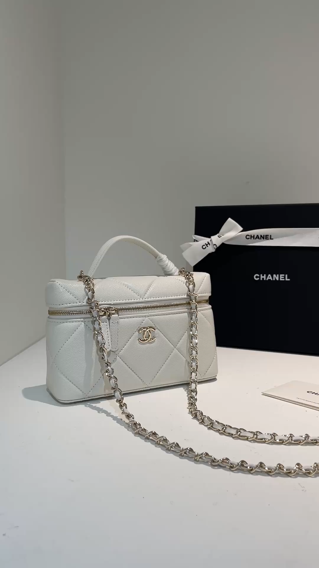 White Quilted Caviar Calfskin Vanity Case with Top Handle and Gold-Tone Chain Strap - Mocuir