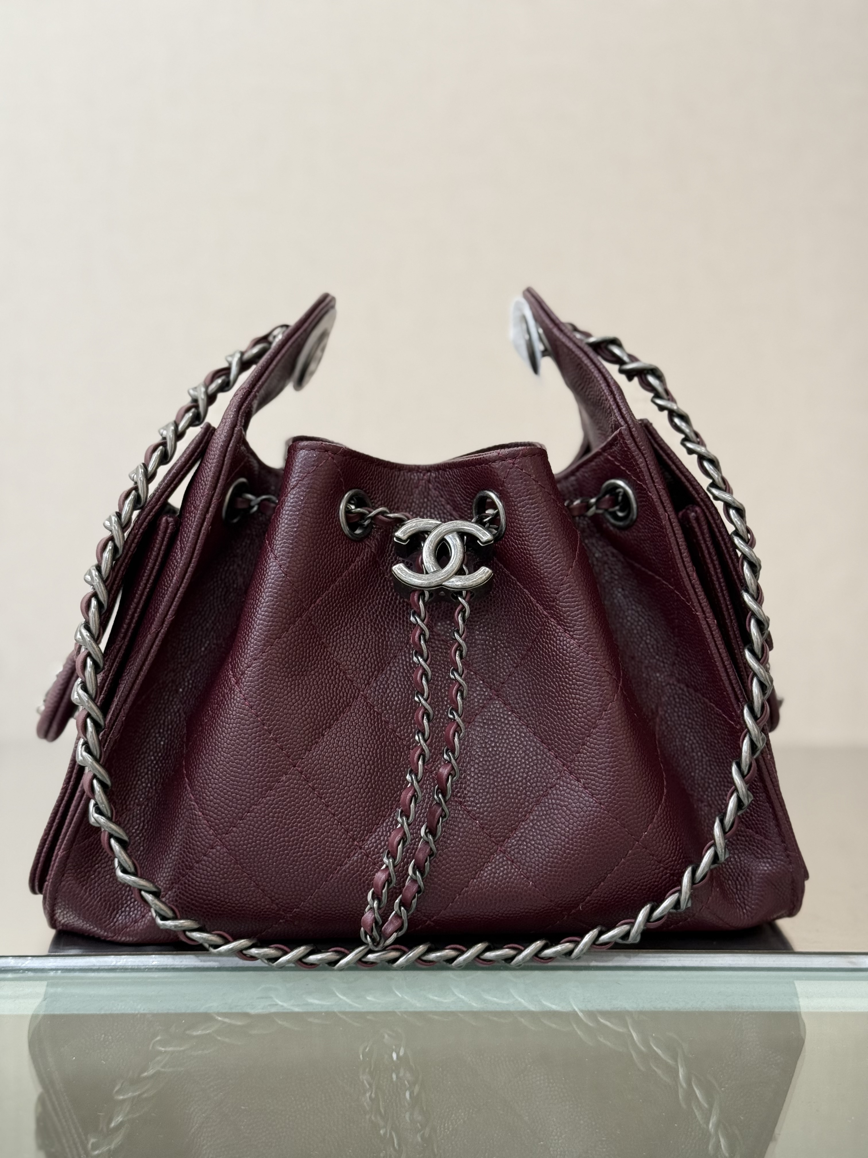Spring-Summer 2025 Burgundy Quilted Grained Calfskin Drawstring Bucket Bag with Ruthenium-Finish Hardware - Mocuir