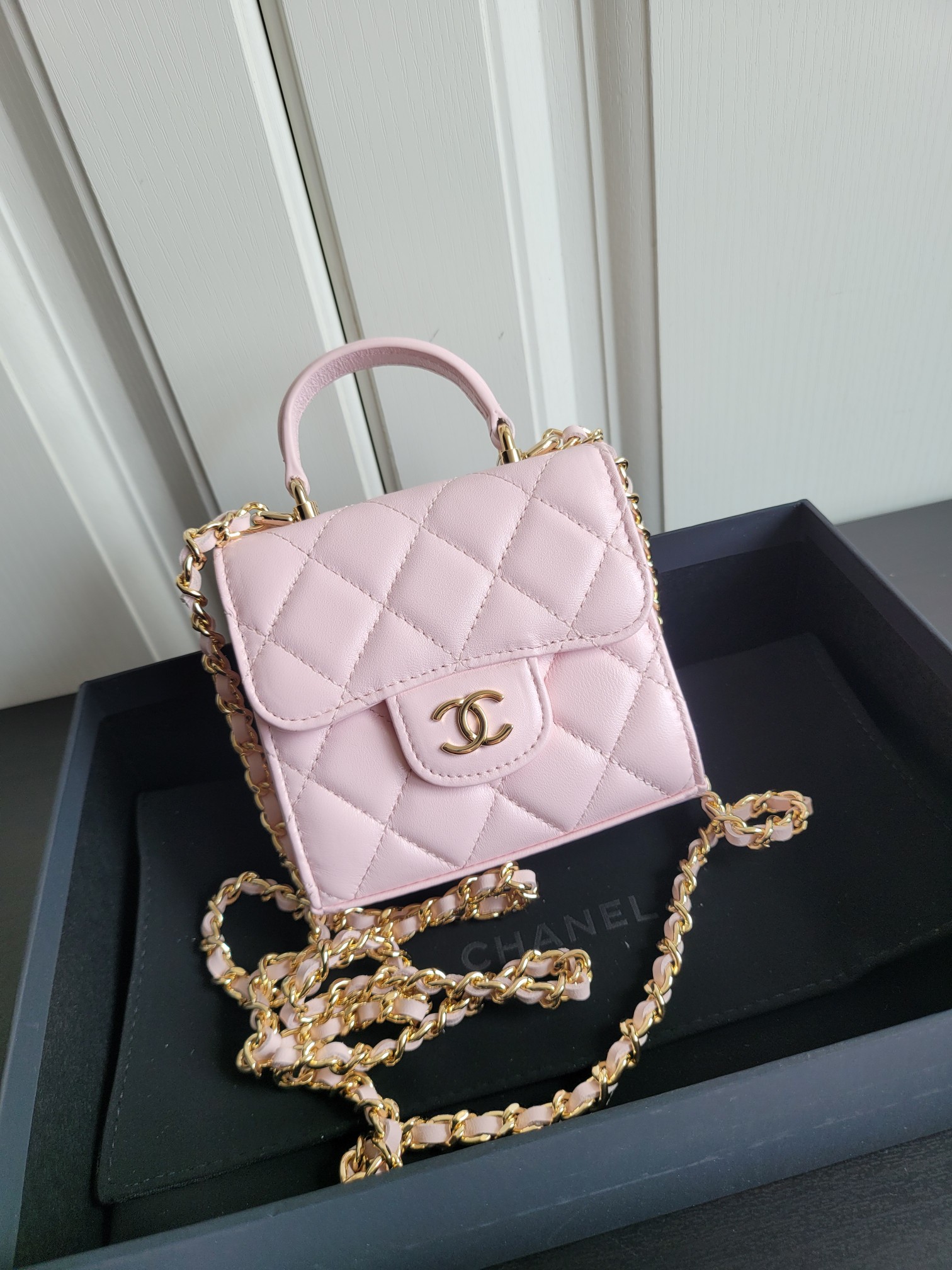 23P Mini Classic Flap Bag with Top Handle in Sakura Pink Quilted Smooth Lambskin with Light Gold-Tone Hardware - Mocuir