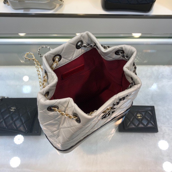 Gabrielle Small Quilted Aged Calfskin Backpack in White & Black - Mocuir