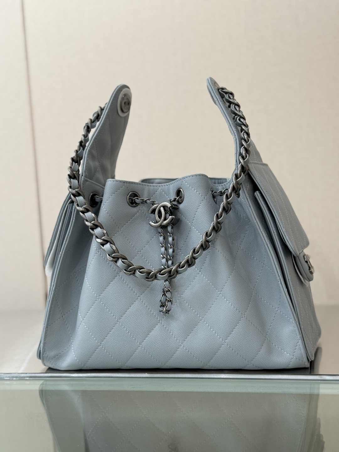 Spring-Summer 2025 Light Blue Quilted Grained Calfskin Drawstring Bucket Bag with Ruthenium-Finish Hardware - Mocuir