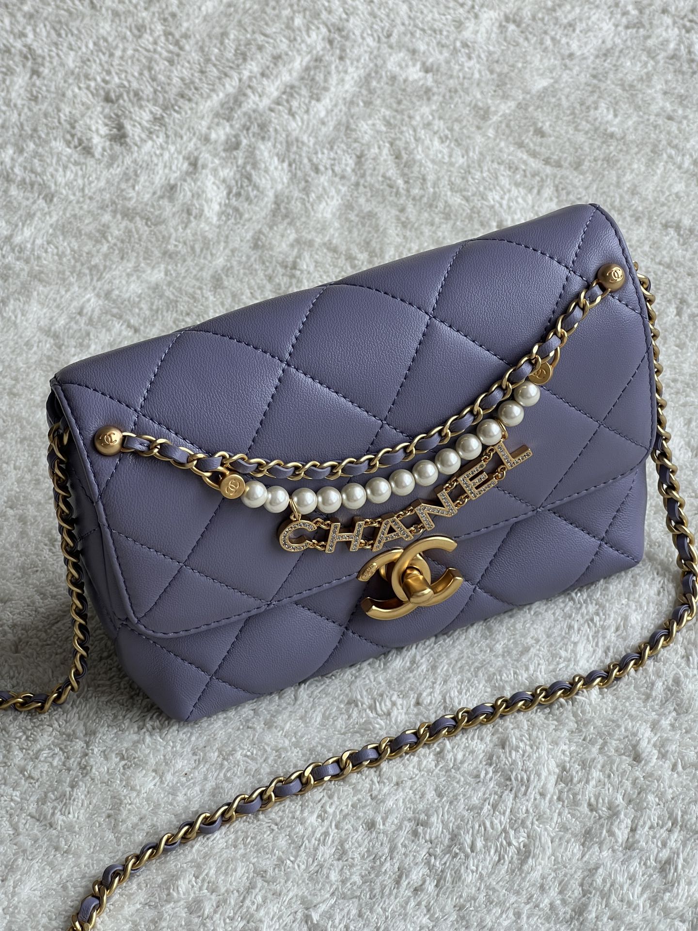 24A Mini Classic Flap Bag in Tato Purple Quilted Lambskin with Pearl & Crystal CHANEL Letter Chain and Light Gold-Tone Hardware (AS4997) - Mocuir