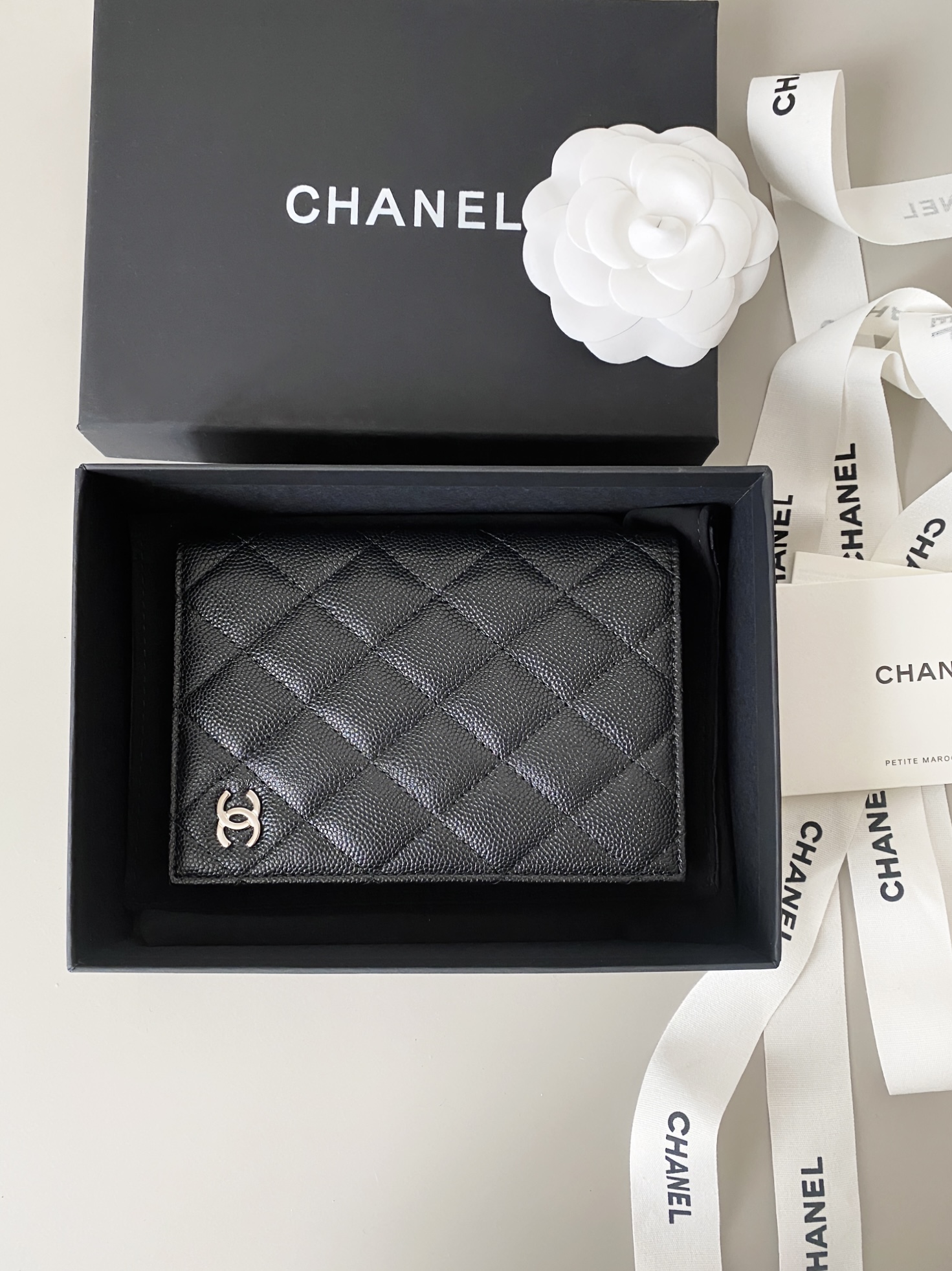 Classic Quilted Caviar Leather Passport Holder with Silver-Tone CC Logo - Mocuir