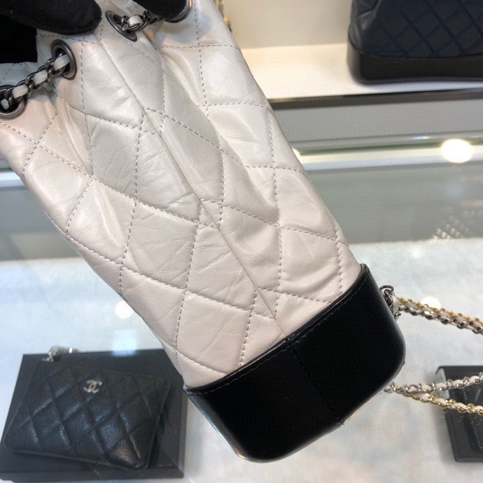 Gabrielle Small Quilted Aged Calfskin Backpack in White & Black - Mocuir