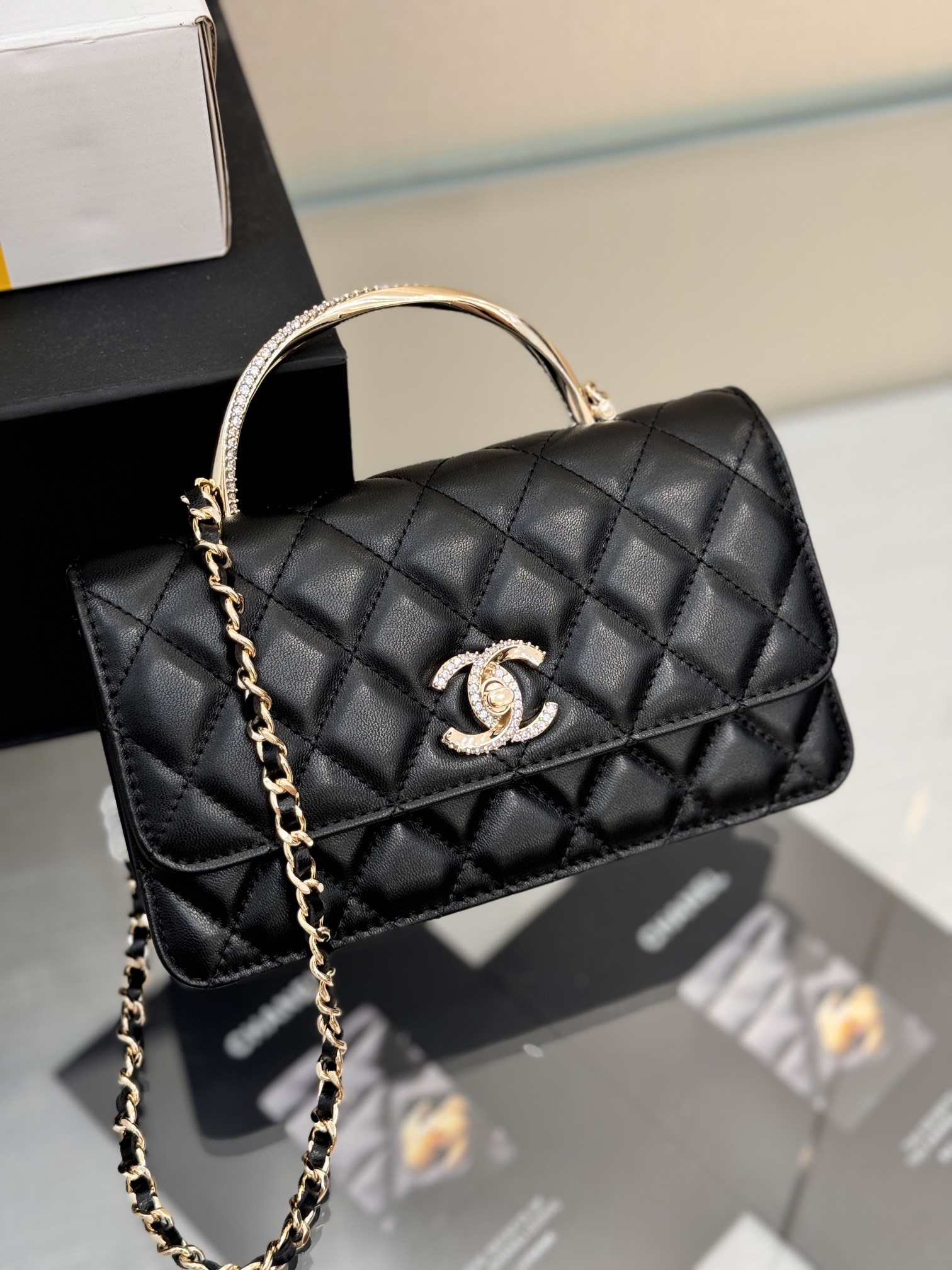 Wallet on Chain (WOC) with Crystal-Embellished Handle in Black Quilted Lambskin with Gold-Tone Hardware - Mocuir