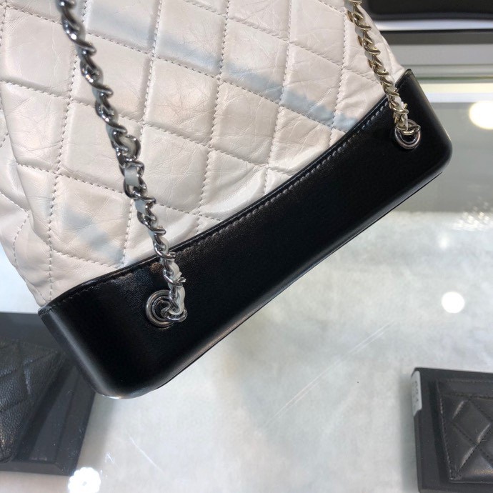 Gabrielle Small Quilted Aged Calfskin Backpack in White & Black - Mocuir