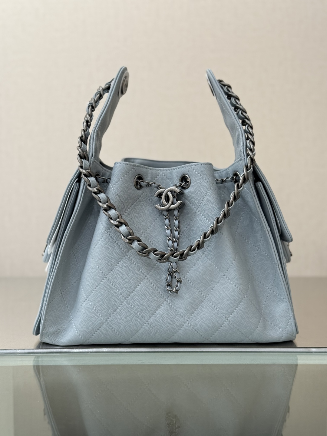 Spring-Summer 2025 Light Blue Quilted Grained Calfskin Drawstring Bucket Bag with Ruthenium-Finish Hardware - Mocuir