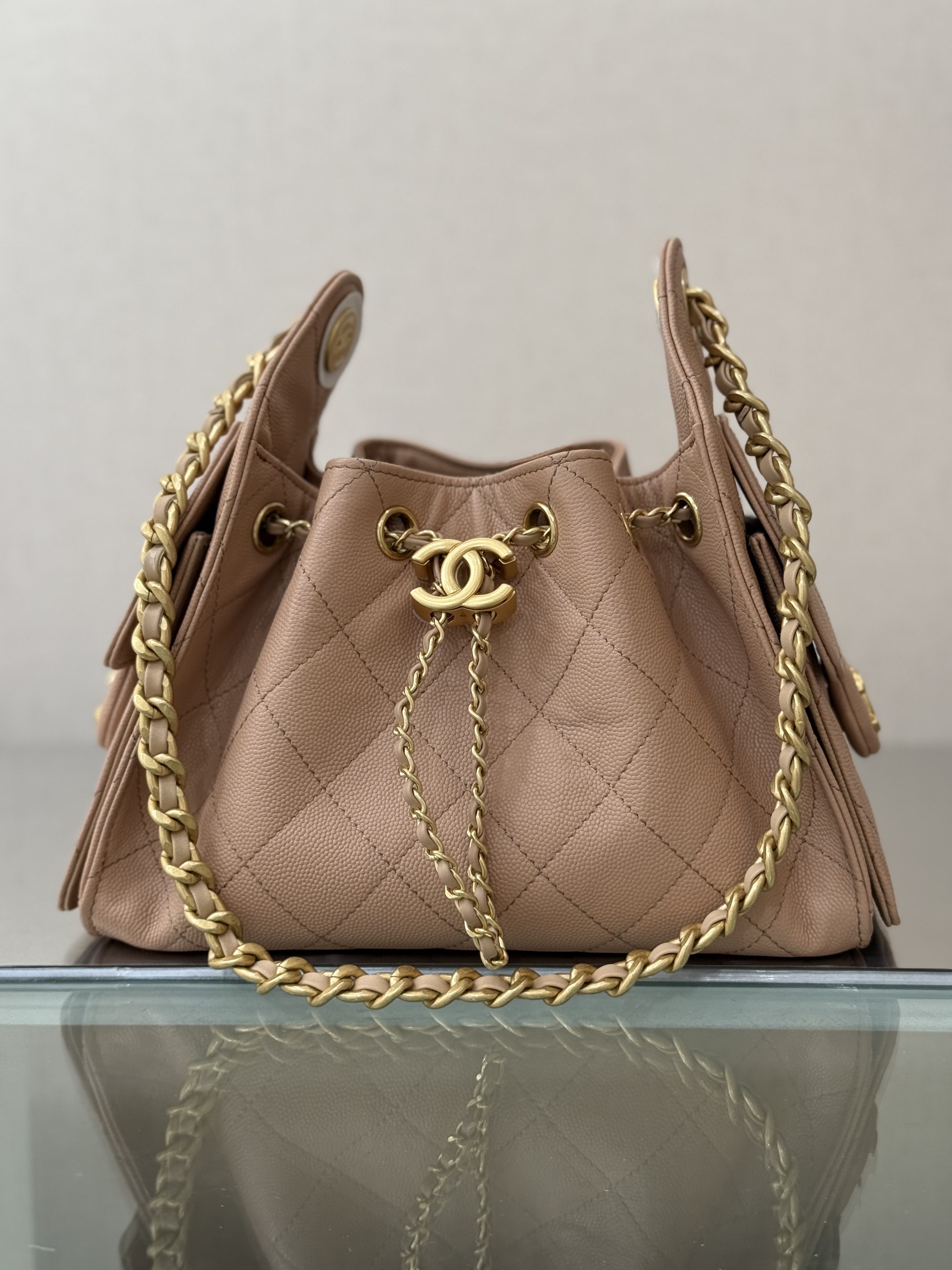 Spring-Summer 2025 Beige Quilted Grained Calfskin Drawstring Bucket Bag with Gold-Tone Hardware - Mocuir