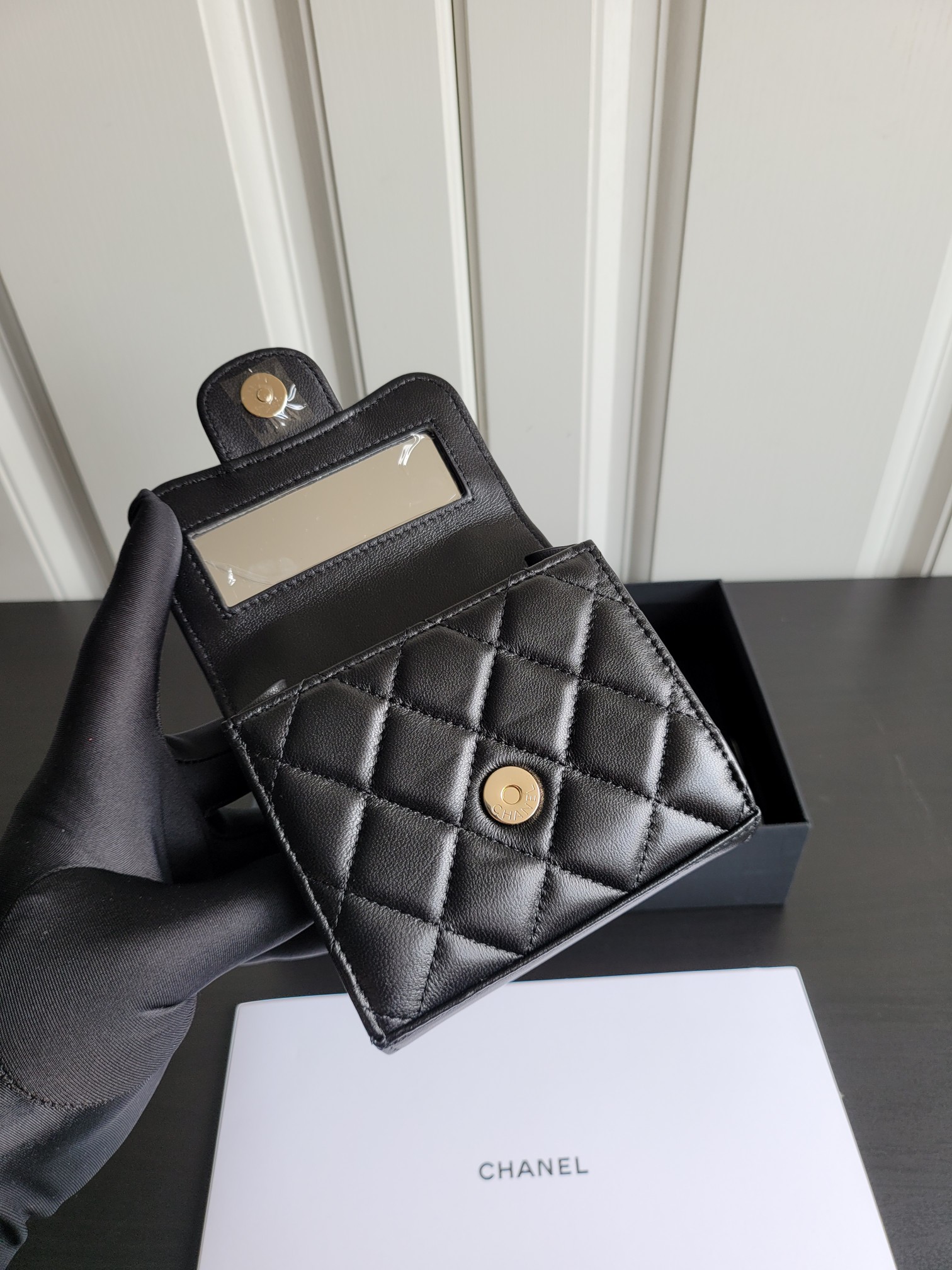 23P Mini Classic Flap Bag with Top Handle in Black Quilted Caviar Leather with Light Gold-Tone Hardware - Mocuir