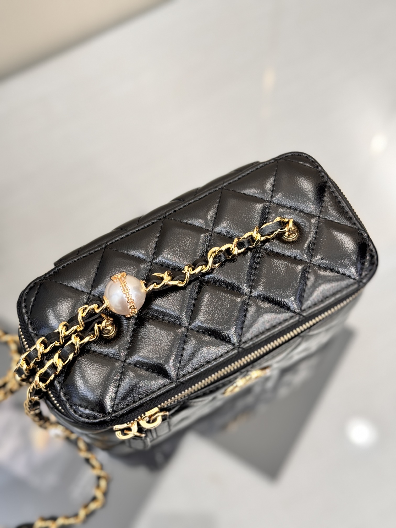 Long Vanity Case with Chain & Pearl Detail in Black Quilted Lambskin with Light Gold-Tone Hardware - Mocuir
