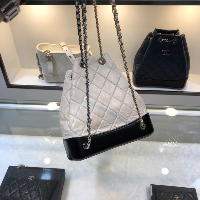 Gabrielle Small Quilted Aged Calfskin Backpack in White & Black - Mocuir