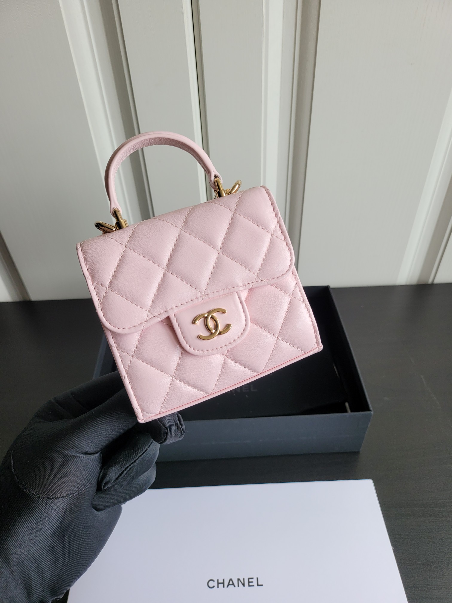23P Mini Classic Flap Bag with Top Handle in Sakura Pink Quilted Smooth Lambskin with Light Gold-Tone Hardware - Mocuir