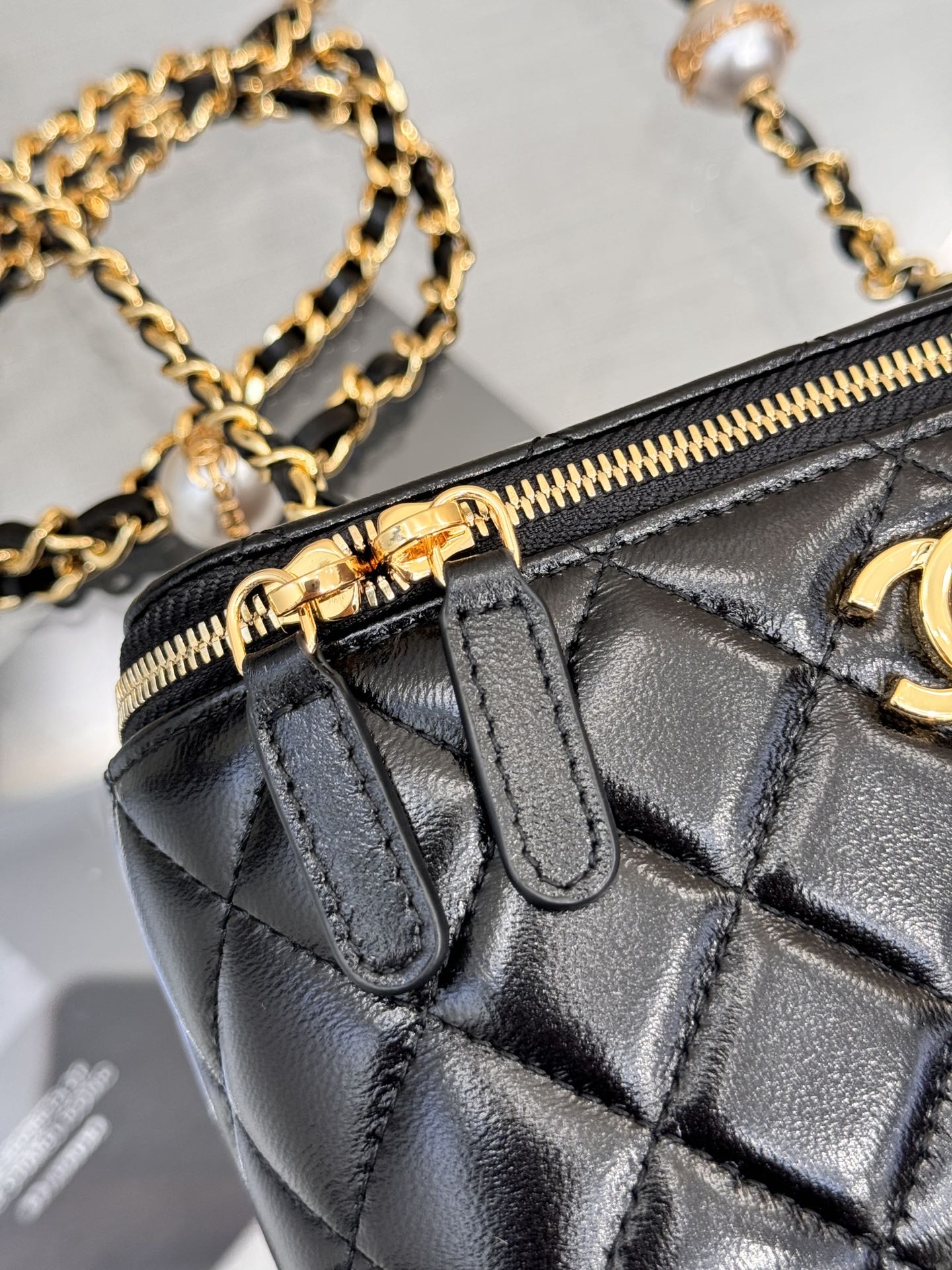 Long Vanity Case with Chain & Pearl Detail in Black Quilted Lambskin with Light Gold-Tone Hardware - Mocuir