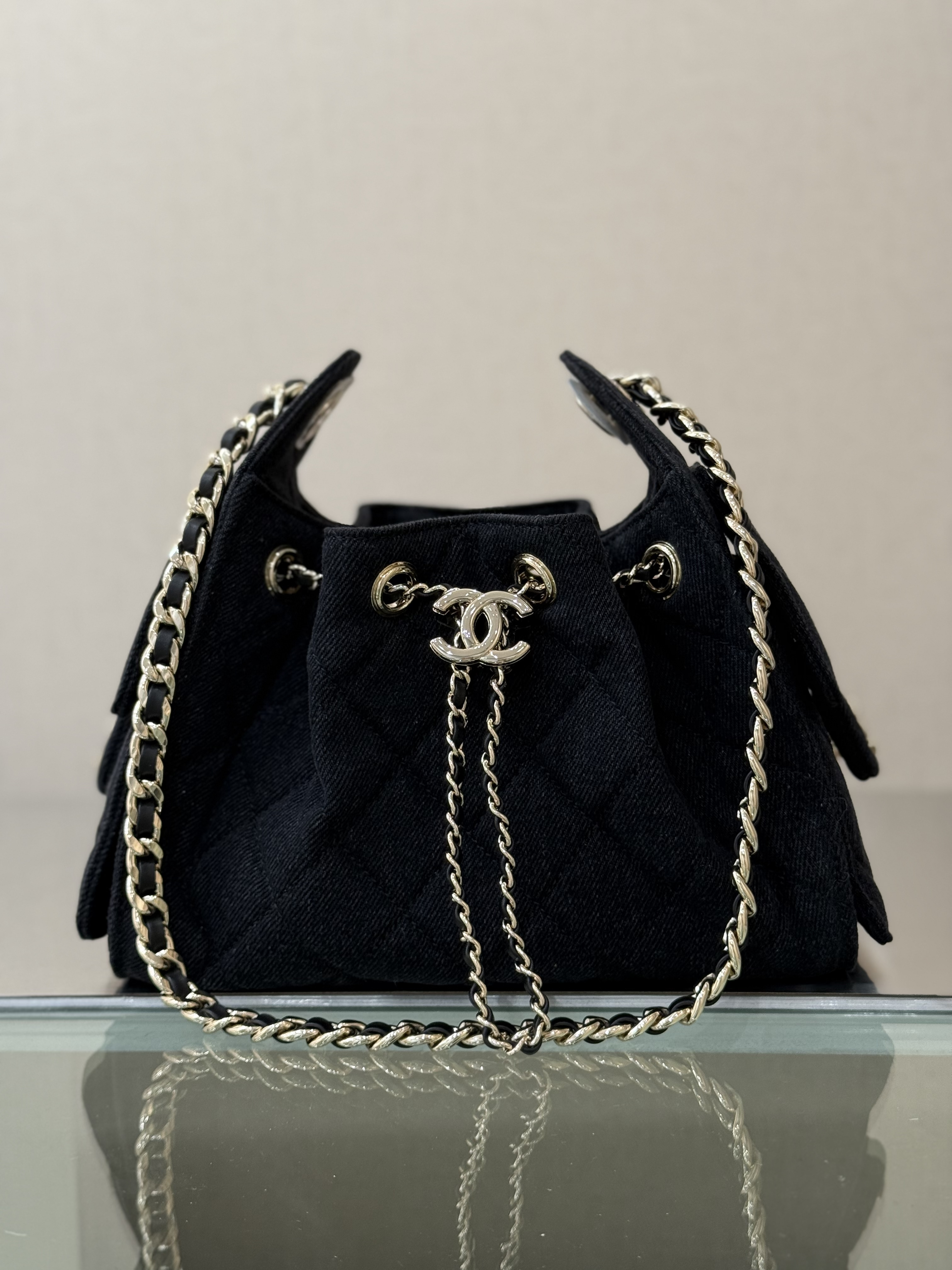 Spring-Summer 2025 Black Quilted Denim Drawstring Bucket Bag with Gold-Tone - Mocuir