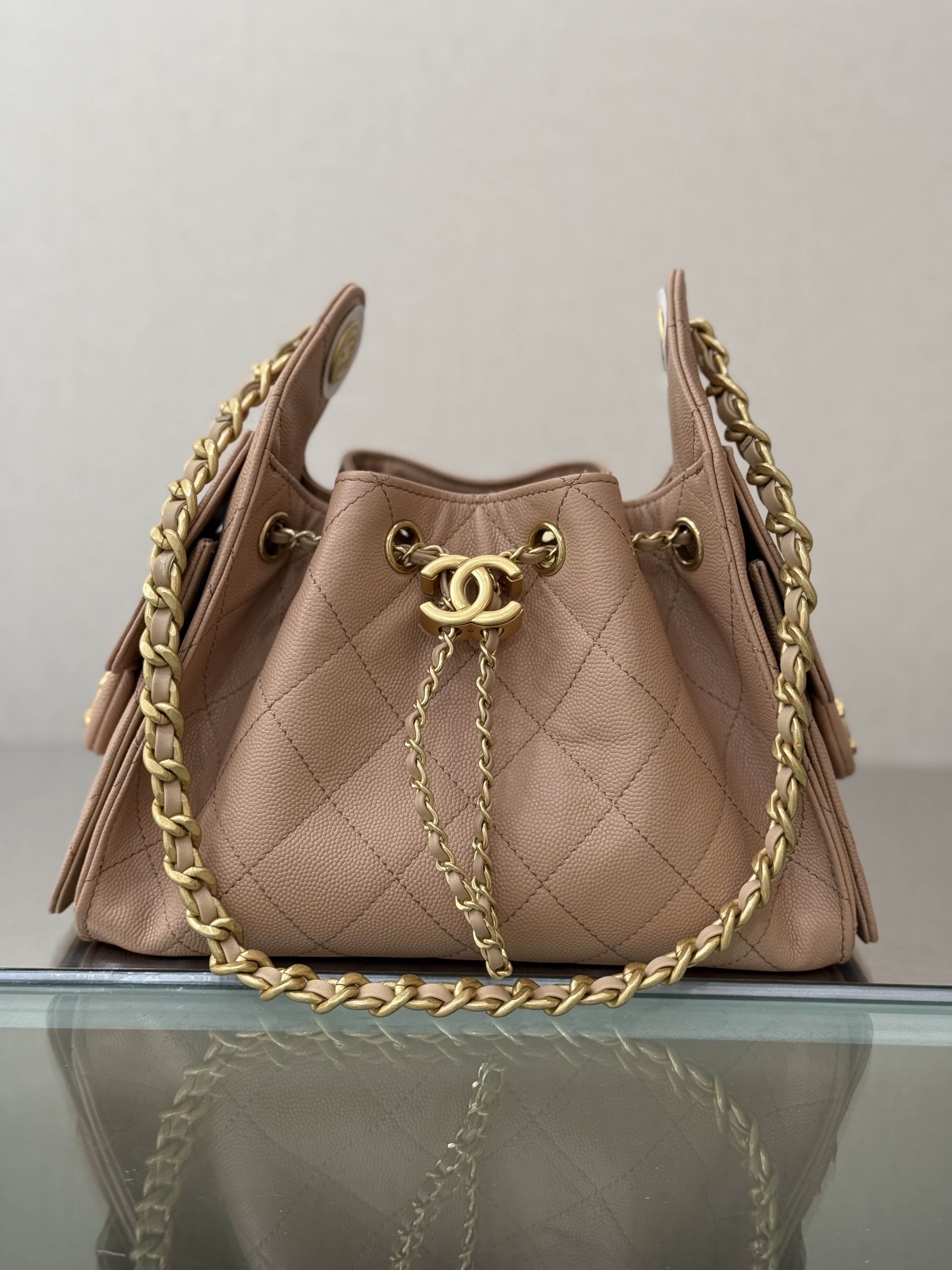 Spring-Summer 2025 Beige Quilted Grained Calfskin Drawstring Bucket Bag with Gold-Tone Hardware - Mocuir