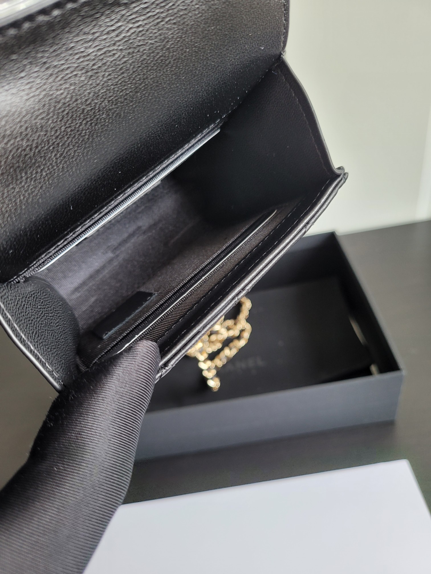 23P Mini Classic Flap Bag with Top Handle in Black Quilted Caviar Leather with Light Gold-Tone Hardware - Mocuir