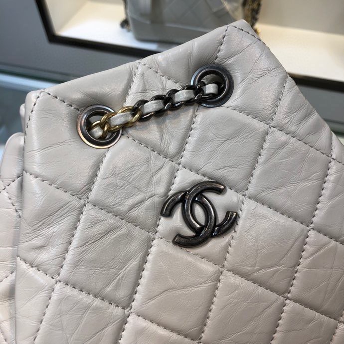 Gabrielle Small Quilted Aged Calfskin Backpack in White & Black - Mocuir