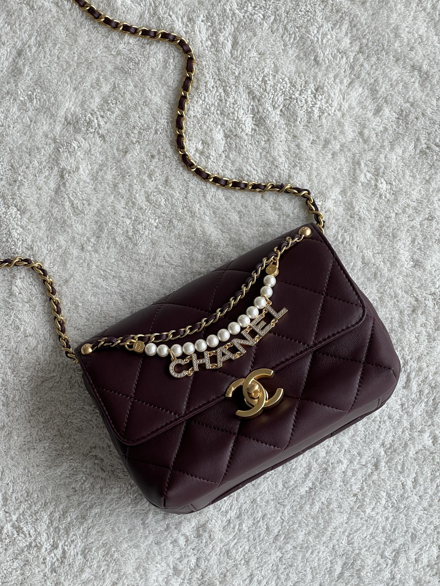 24A Mini Classic Flap Bag in Burgundy Quilted Lambskin with Pearl & Crystal CHANEL Letter Chain and Light Gold-Tone Hardware (AS4997) - Mocuir