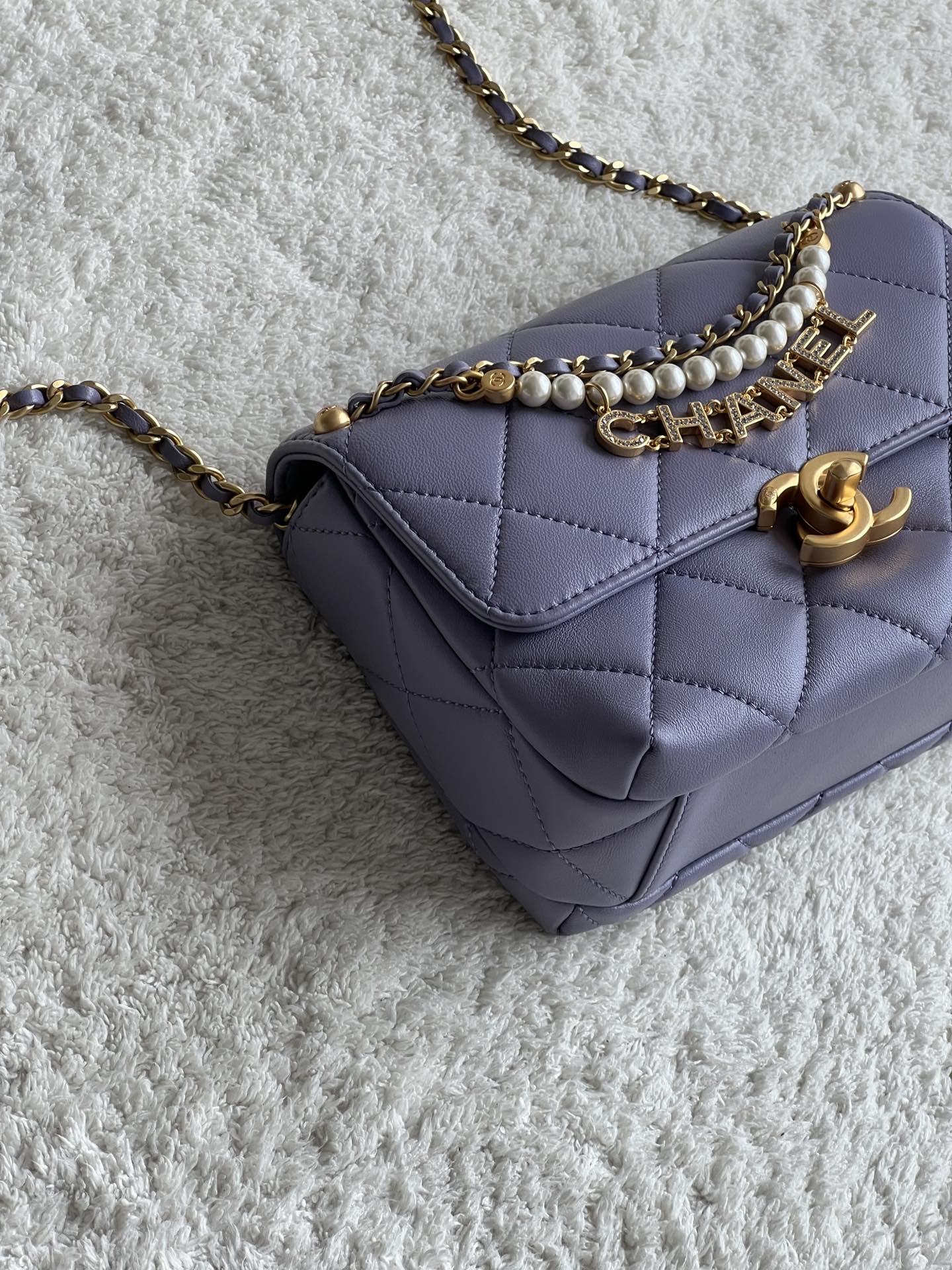 24A Mini Classic Flap Bag in Tato Purple Quilted Lambskin with Pearl & Crystal CHANEL Letter Chain and Light Gold-Tone Hardware (AS4997) - Mocuir