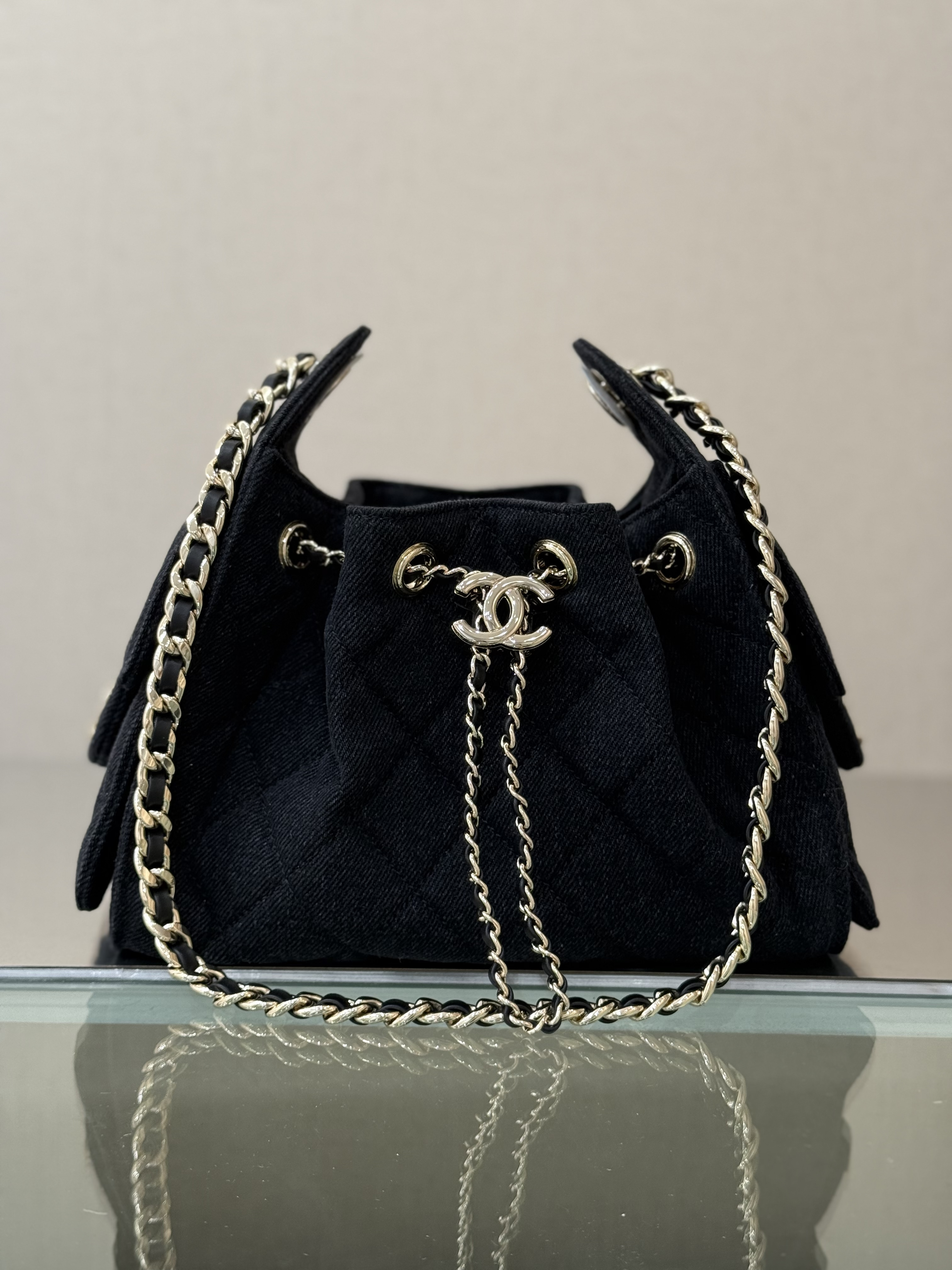 Spring-Summer 2025 Black Quilted Denim Drawstring Bucket Bag with Gold-Tone - Mocuir