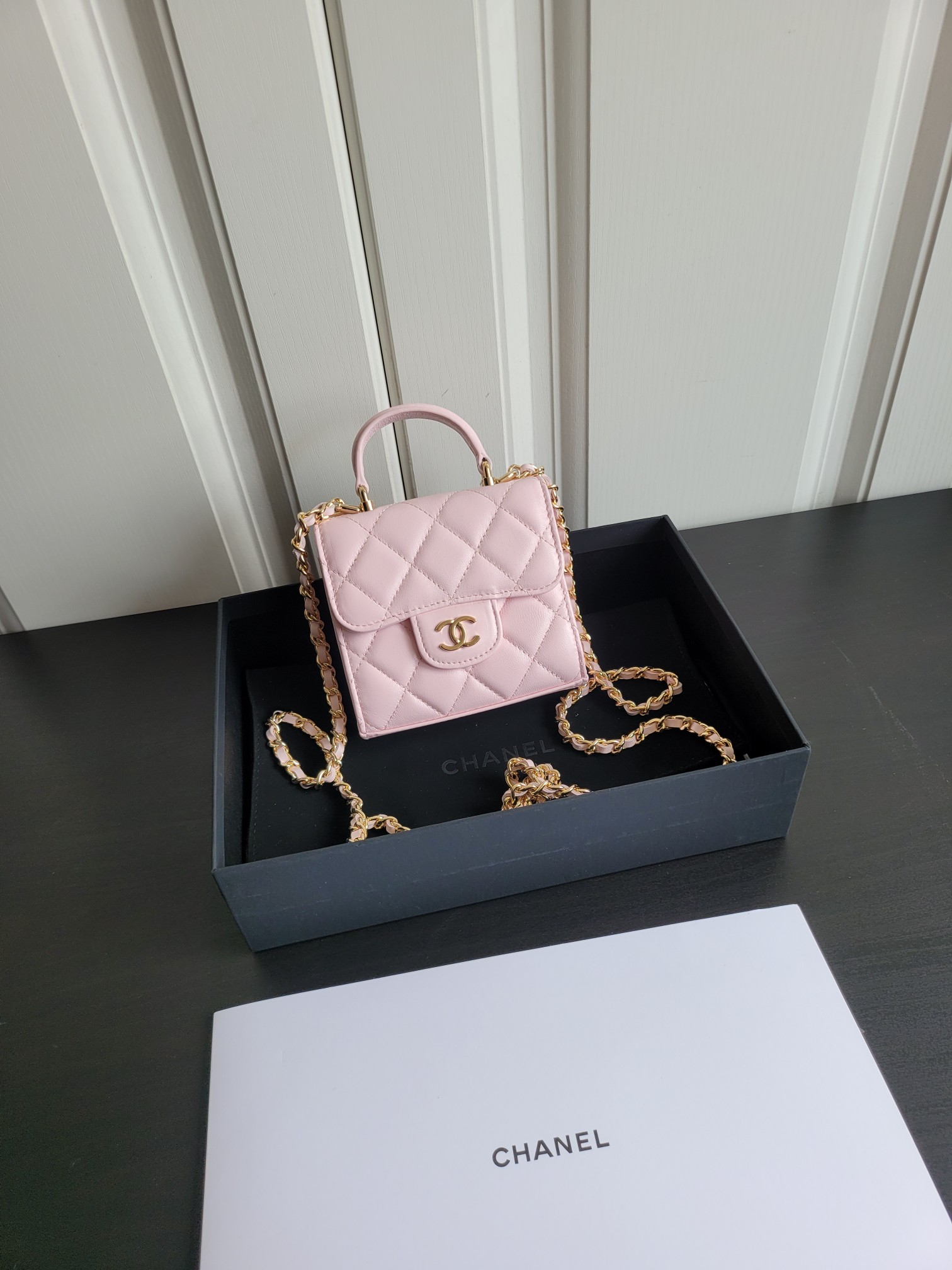 23P Mini Classic Flap Bag with Top Handle in Sakura Pink Quilted Smooth Lambskin with Light Gold-Tone Hardware - Mocuir