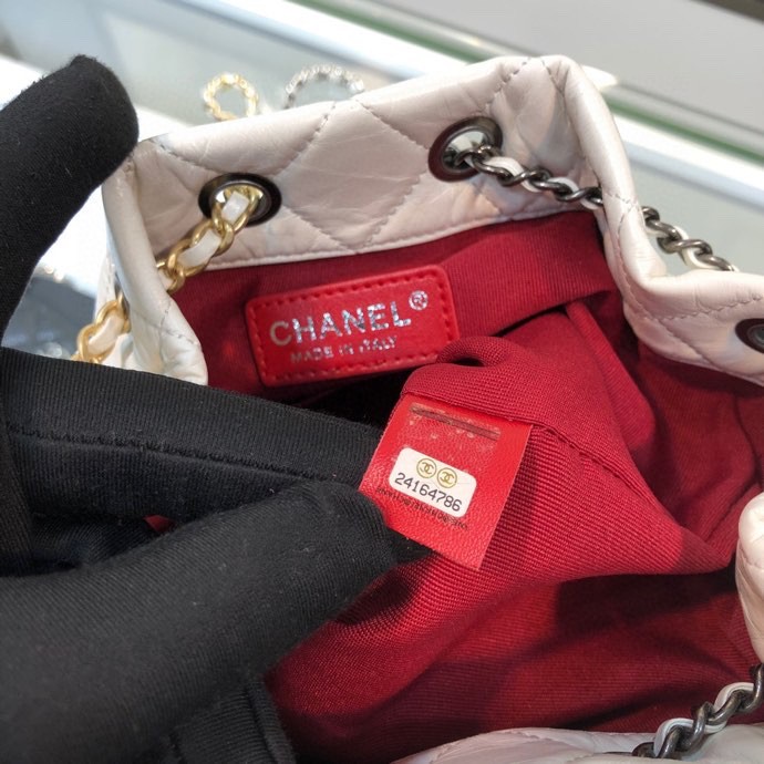 Gabrielle Small Quilted Aged Calfskin Backpack in White & Black - Mocuir