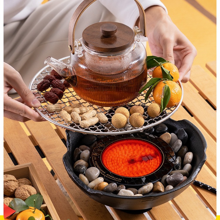 Cooking tea around the stove, baking tea in indoor electric porcelain stove, boiling tea, boiling tea accessories teapot pot tea set.
