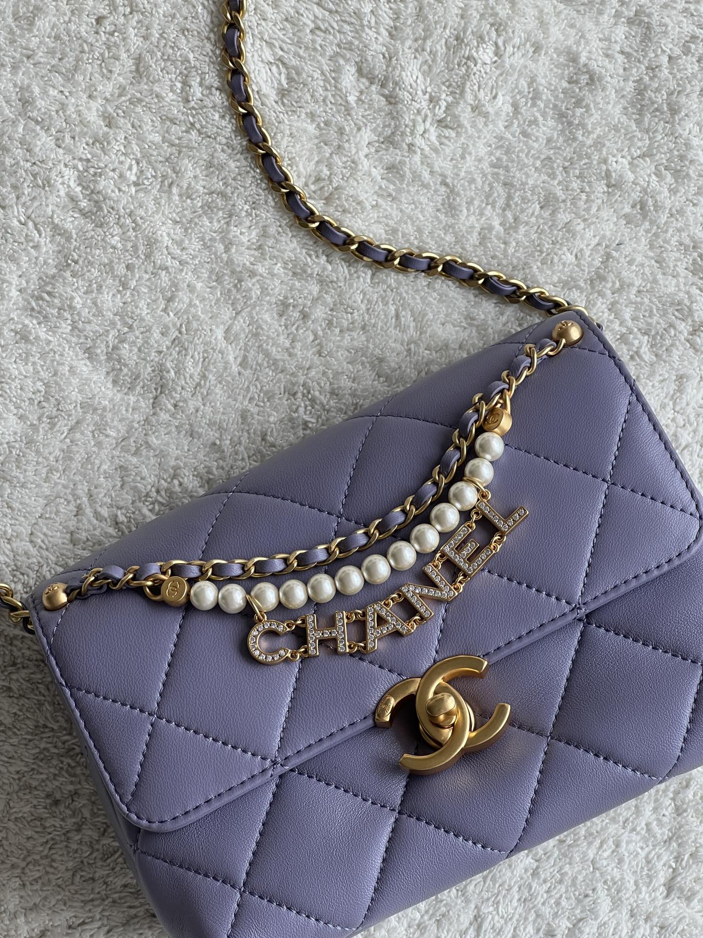 24A Mini Classic Flap Bag in Tato Purple Quilted Lambskin with Pearl & Crystal CHANEL Letter Chain and Light Gold-Tone Hardware (AS4997) - Mocuir