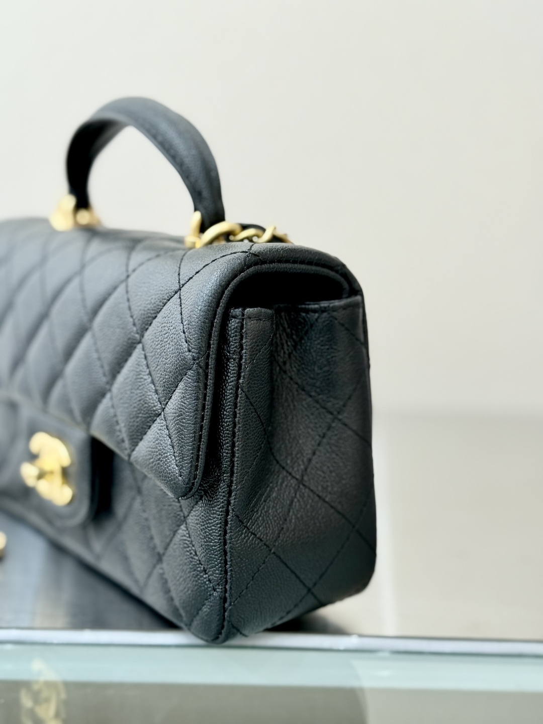 Mini Flap Bag with Top Handle (AS2215) in Black Quilted Grained Calfskin (Caviar) with Antique Gold-Tone Hardware - Mocuir