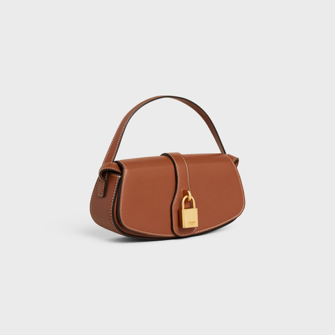 CLUTCH ON STRAP TABOU IN SMOOTH CALFSKIN TAN