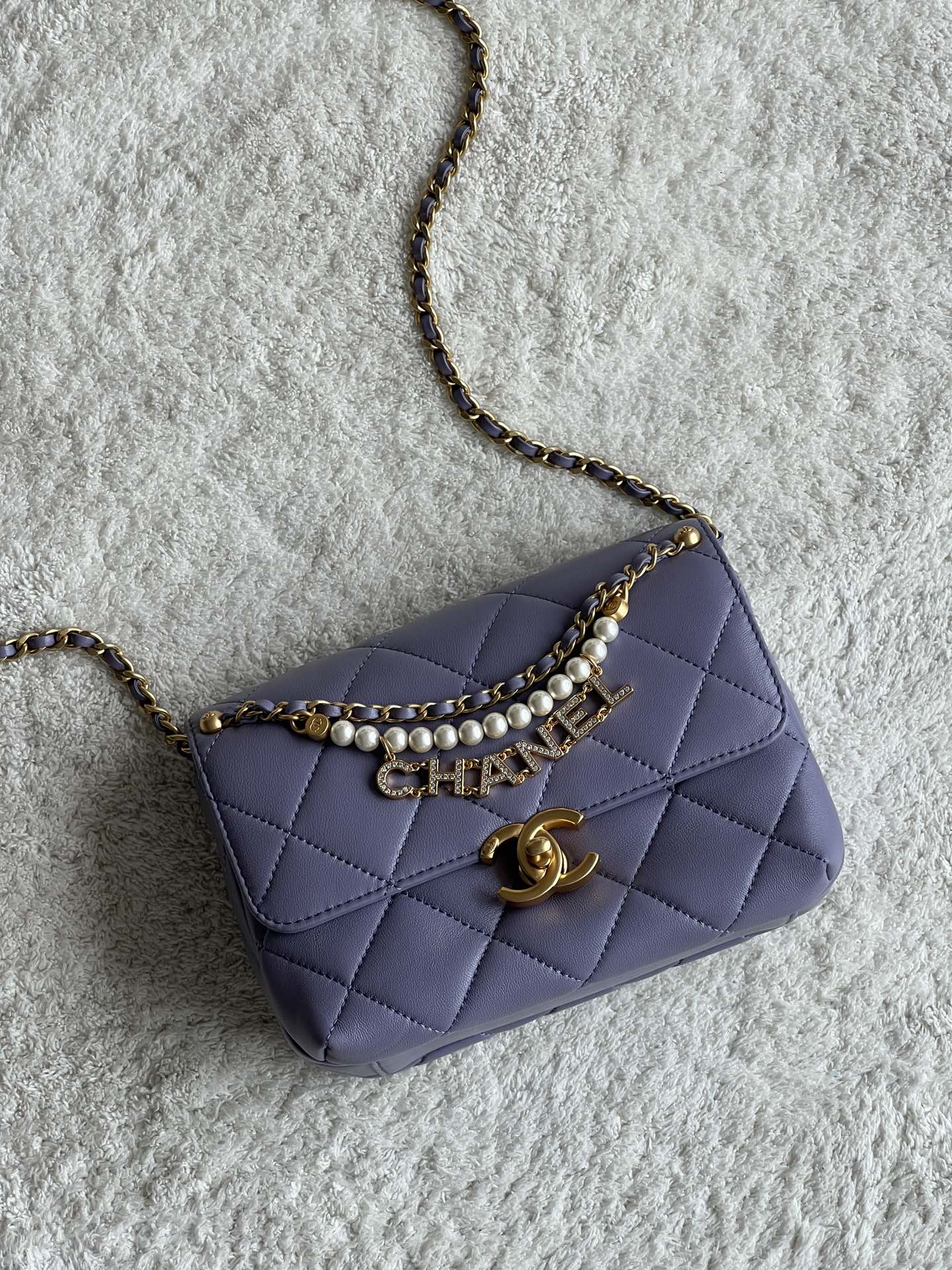 24A Mini Classic Flap Bag in Tato Purple Quilted Lambskin with Pearl & Crystal CHANEL Letter Chain and Light Gold-Tone Hardware (AS4997) - Mocuir