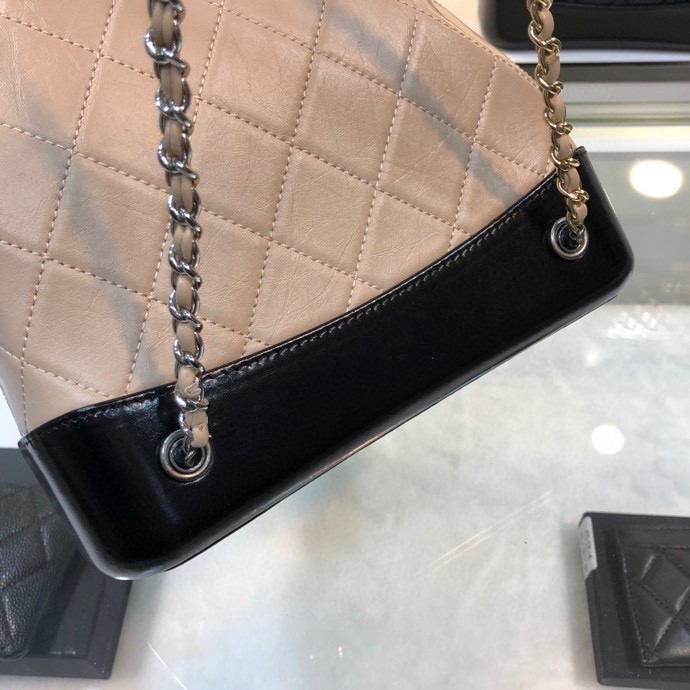 Gabrielle Small Quilted Aged Calfskin Backpack in Beige & Black - Mocuir