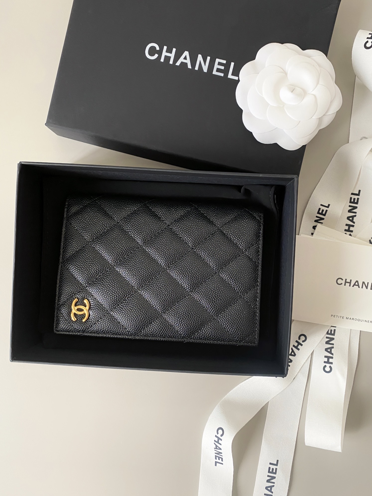 Classic Quilted Caviar Leather Passport Holder with Gold-Tone CC Logo - Mocuir