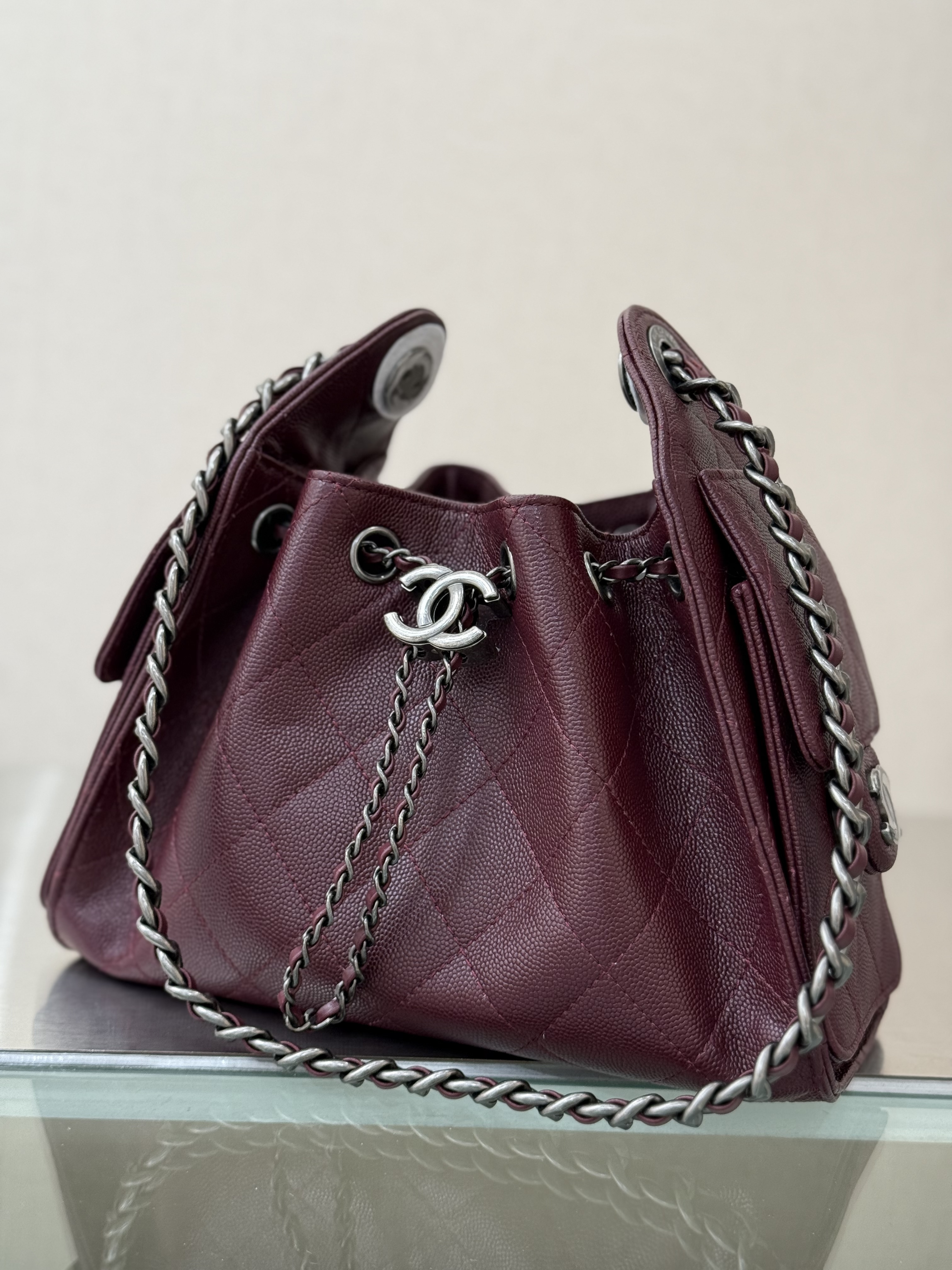 Spring-Summer 2025 Burgundy Quilted Grained Calfskin Drawstring Bucket Bag with Ruthenium-Finish Hardware - Mocuir