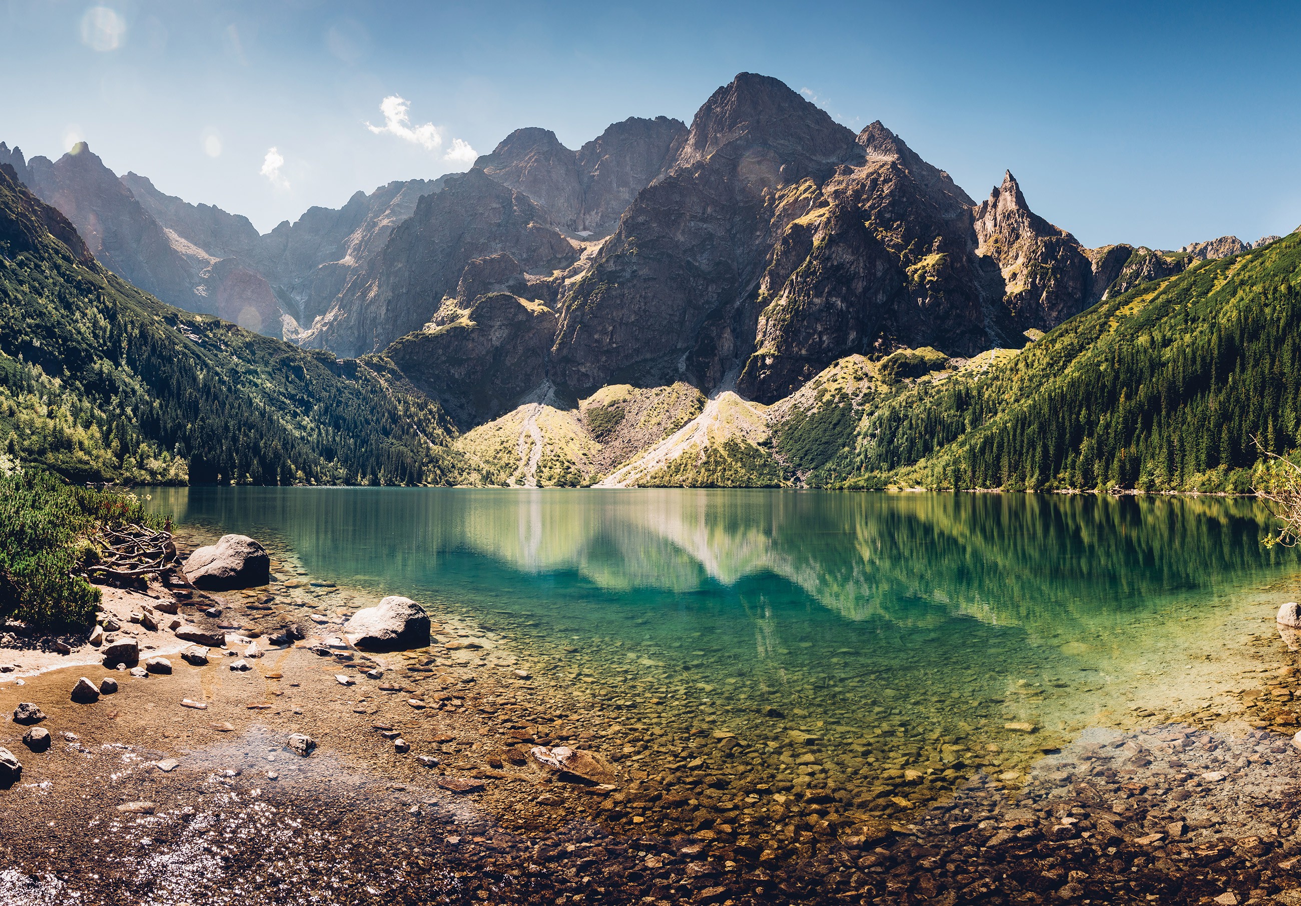 A painting of a mountain landscape with a lake on canvas