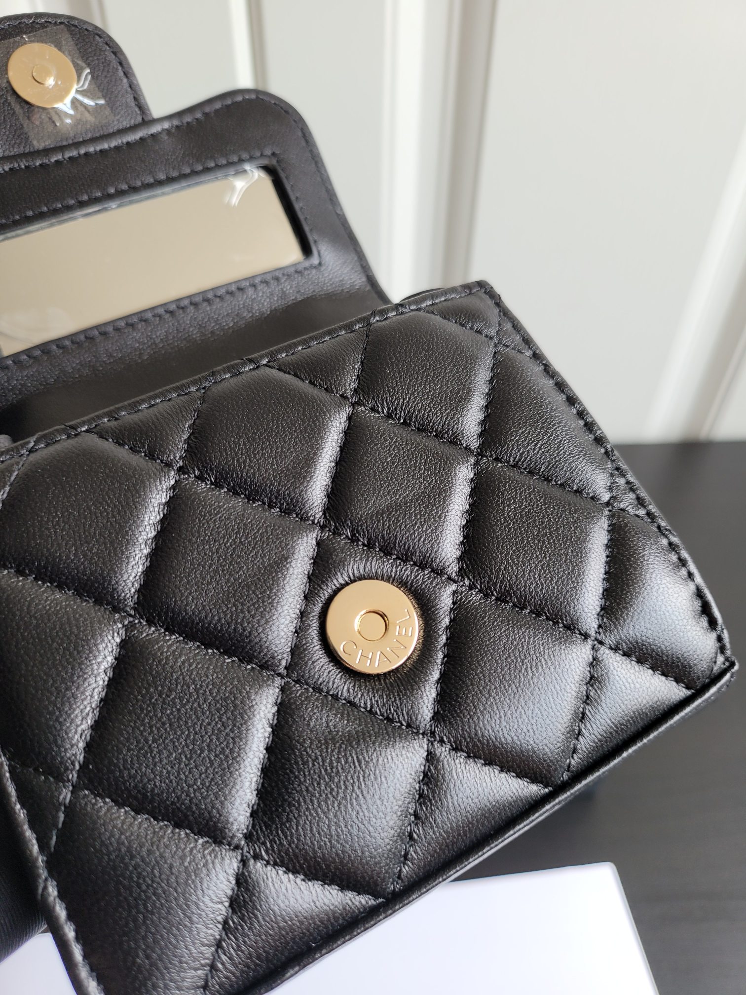 23P Mini Classic Flap Bag with Top Handle in Black Quilted Caviar Leather with Light Gold-Tone Hardware - Mocuir