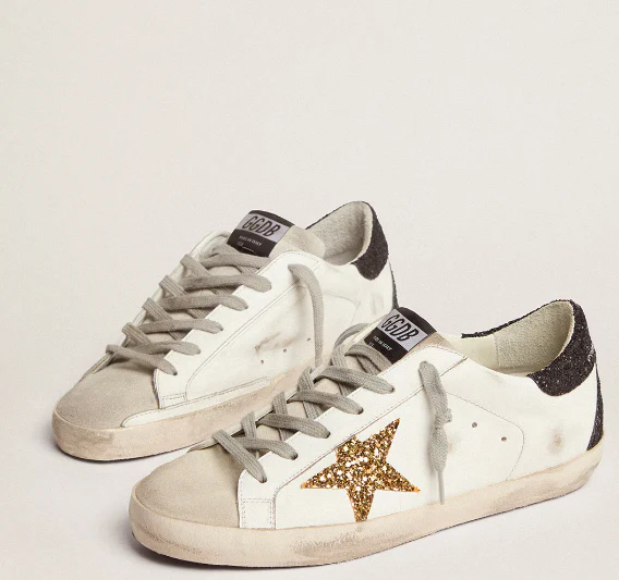 Super-Star LTD with a gold star and black glitter reinforcement