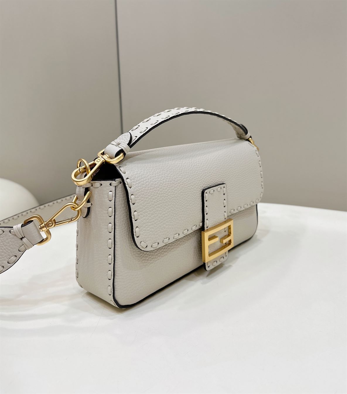 FENDI BAGUETTE CAMELLIA SELLERIA BAG WITH OVERSIZE TOPSTITCHING – F027