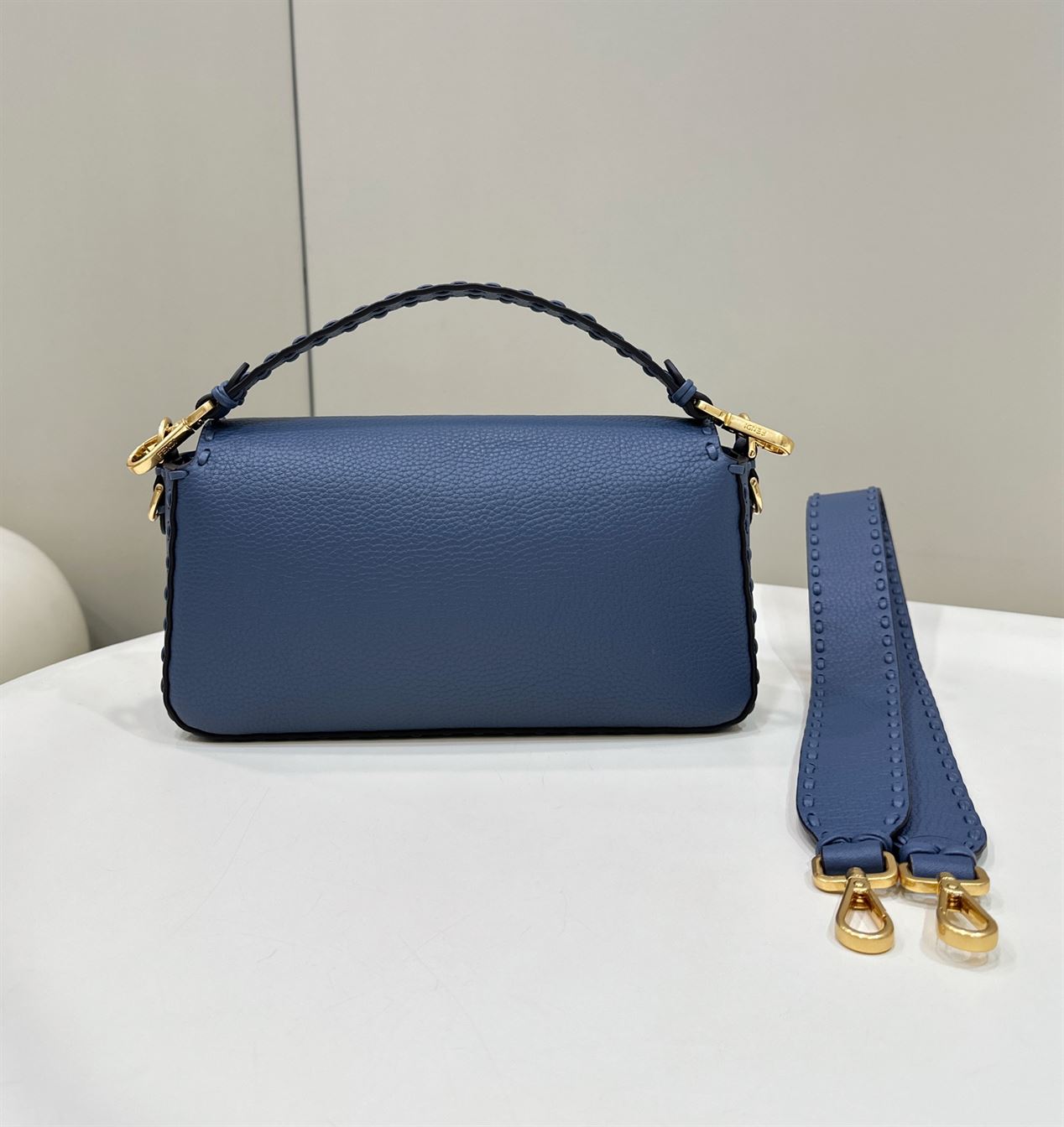 FENDI BAGUETTE BLUE SELLERIA BAG WITH OVERSIZE TOPSTITCHING – F029