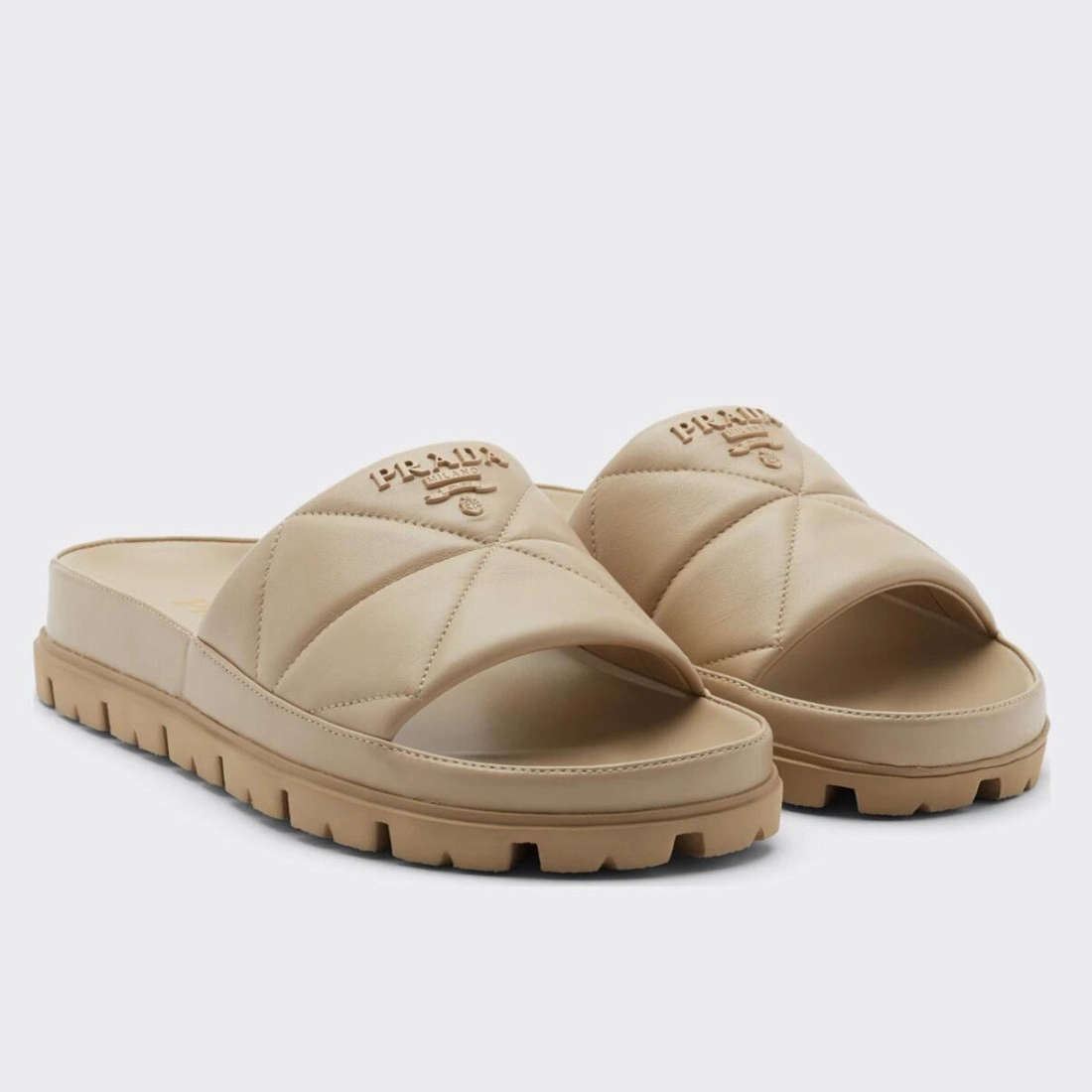 PRADA WOMEN’S SLIDES IN BEIGE QUILTED NAPPA LEATHER – PSD082