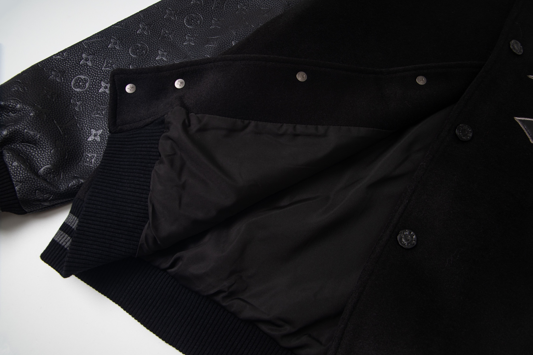 leather-paneled baseball jacket