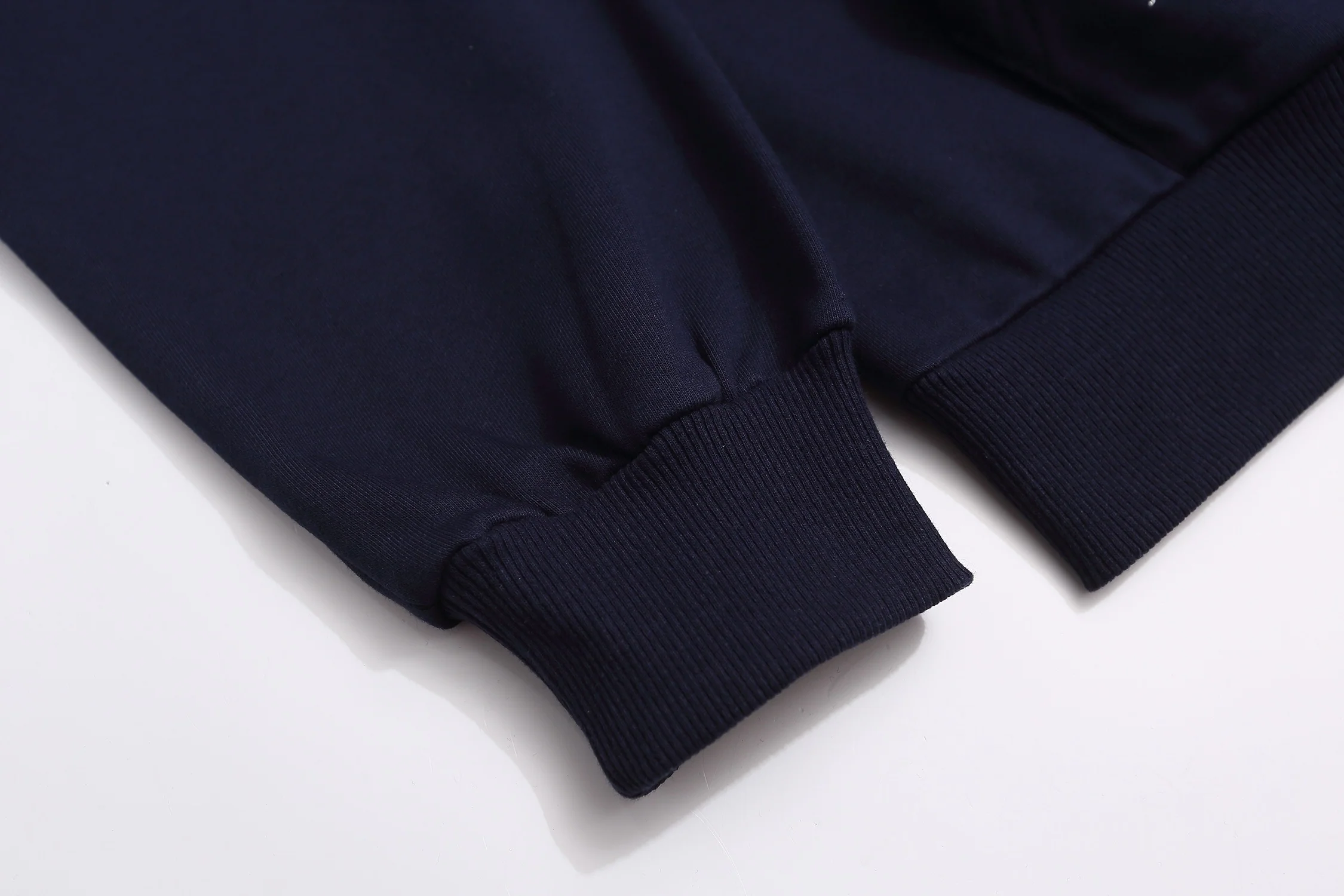 Embroidered sailboat hooded sweatshirt