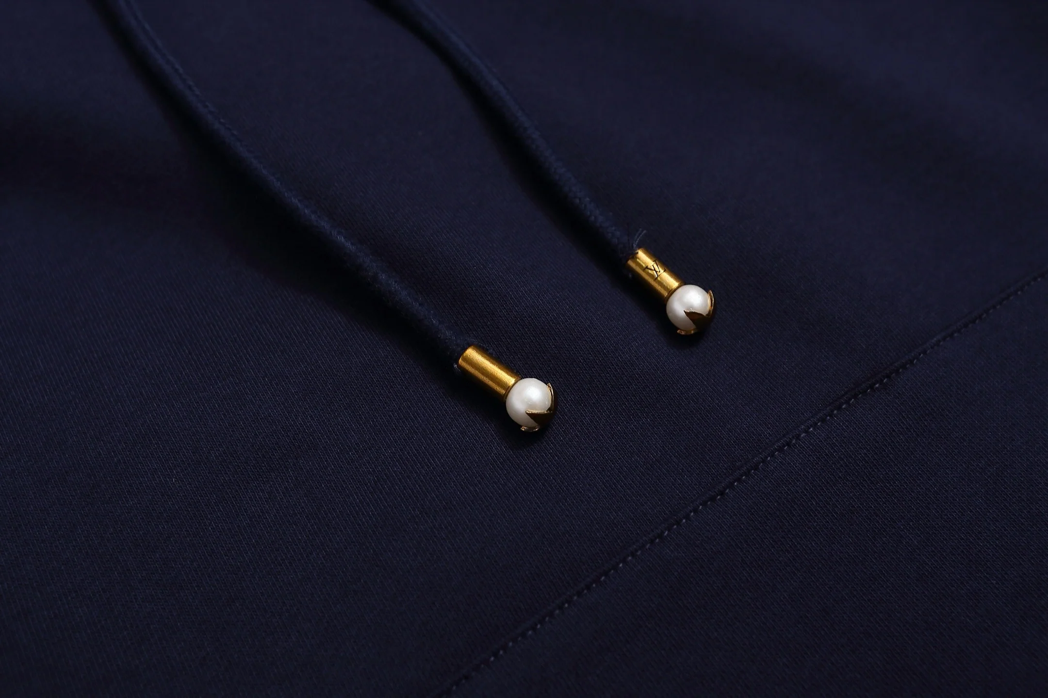 Embroidered sailboat hooded sweatshirt