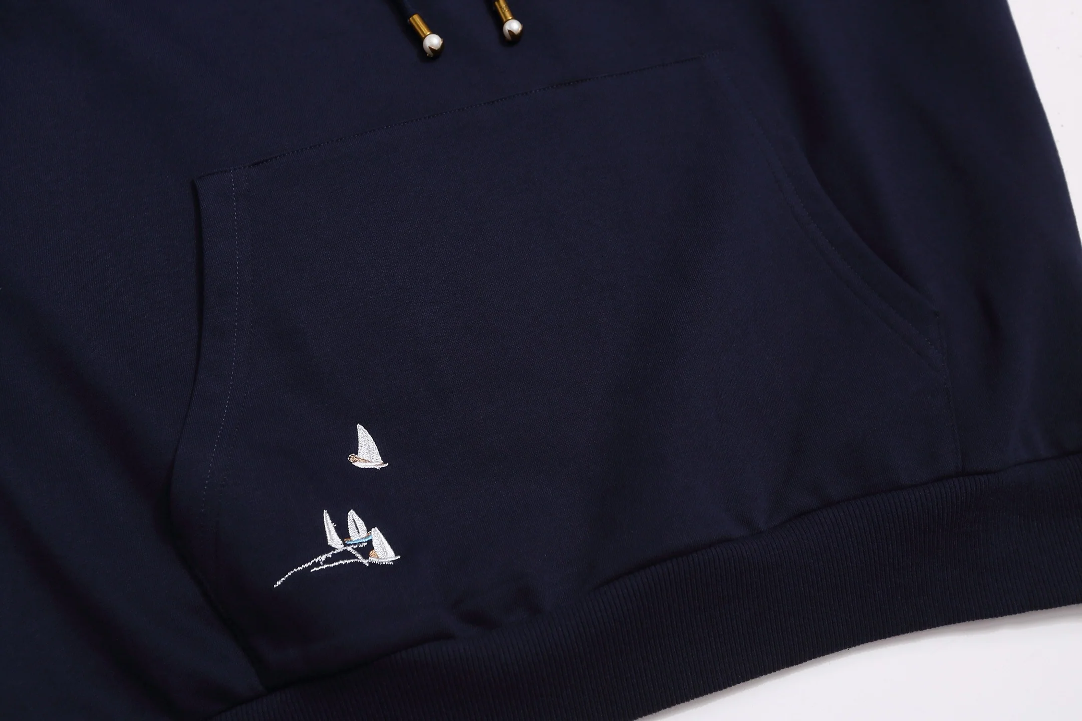 Embroidered sailboat hooded sweatshirt