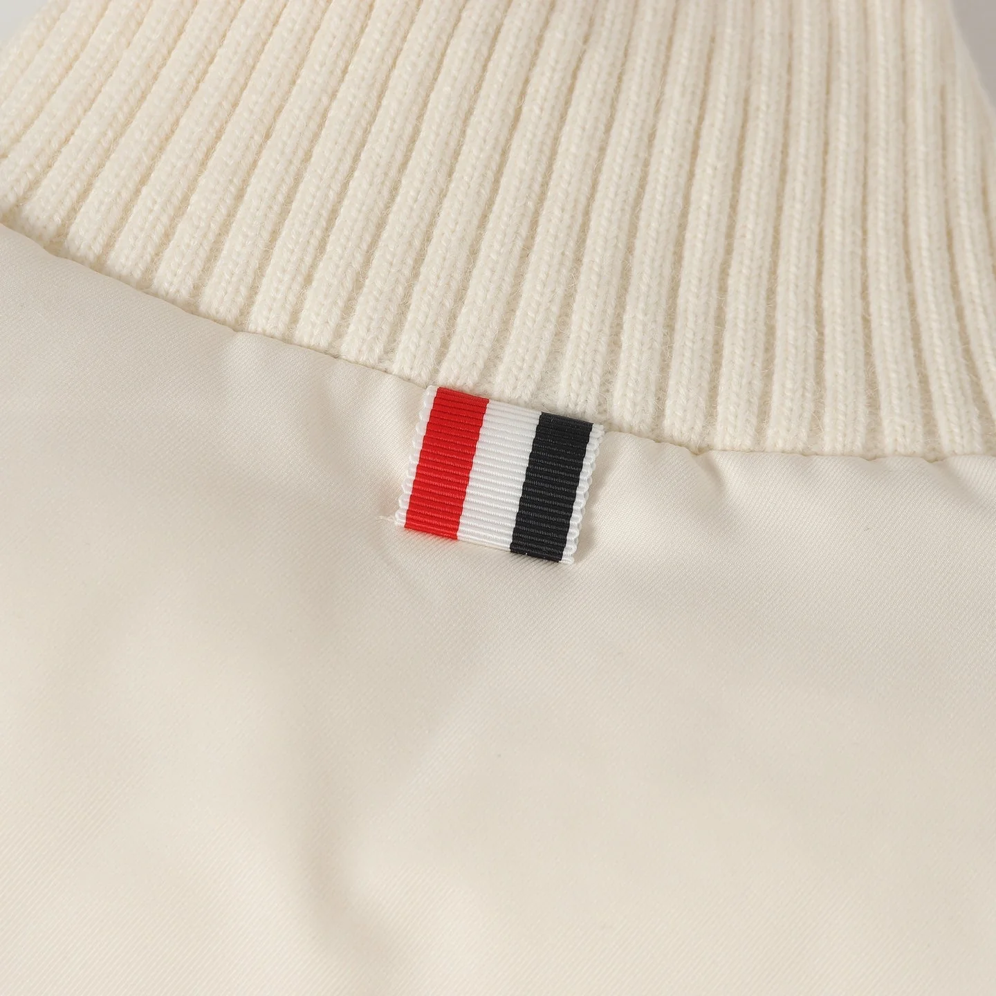 Knitted stand collar down jacket