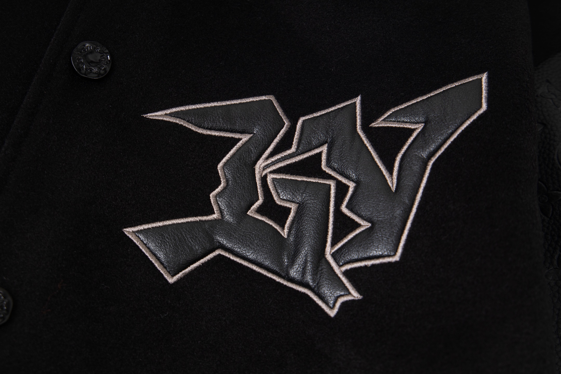 leather-paneled baseball jacket