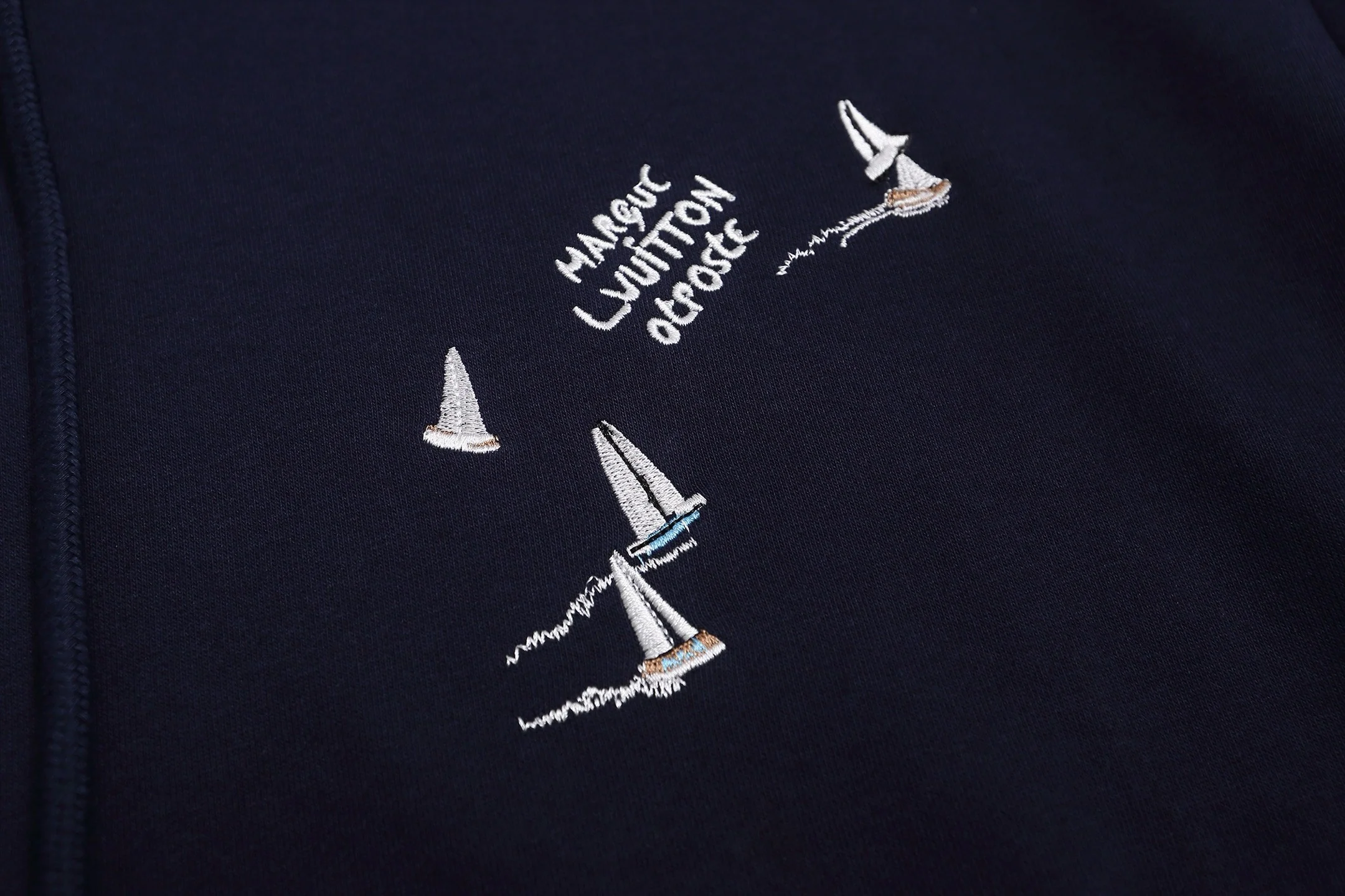 Embroidered sailboat hooded sweatshirt