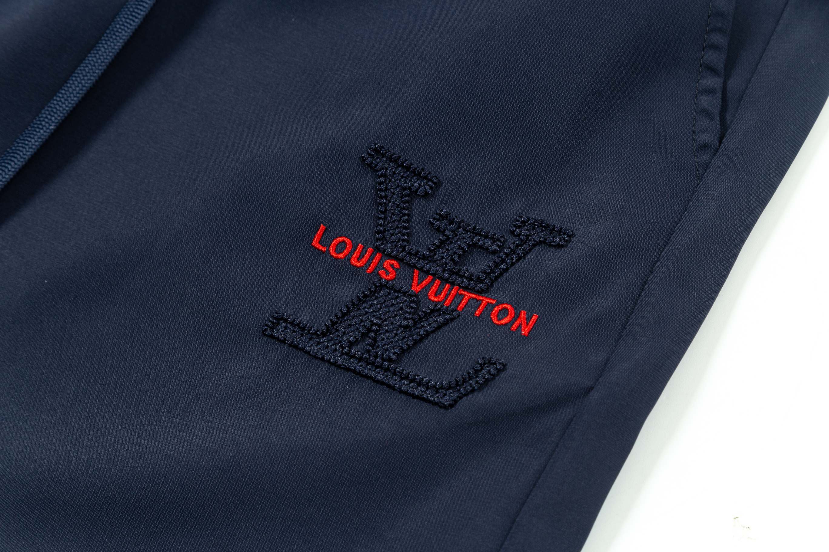 Embroidered nylon beach shorts