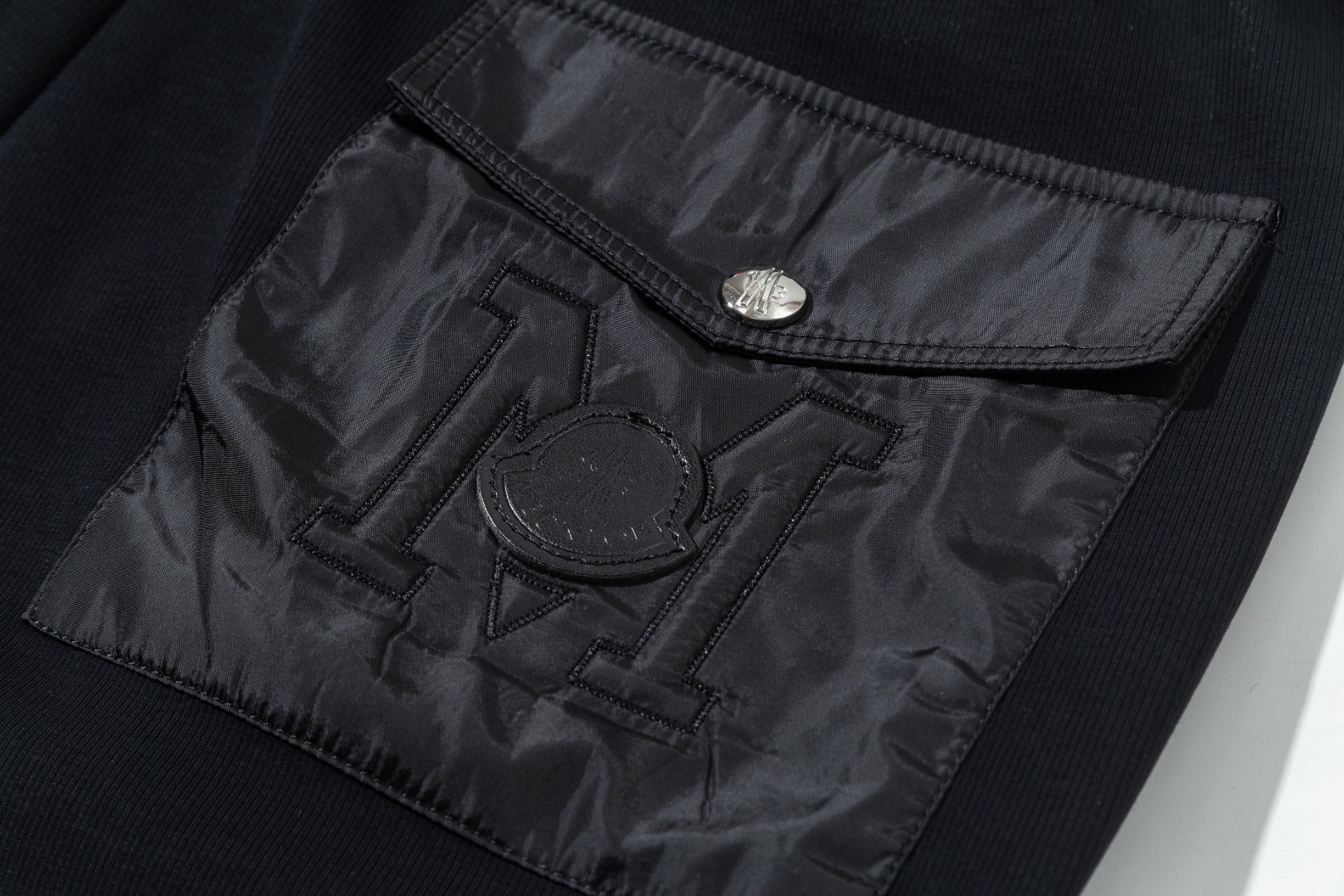 Leather monogram cotton drawstring trousers