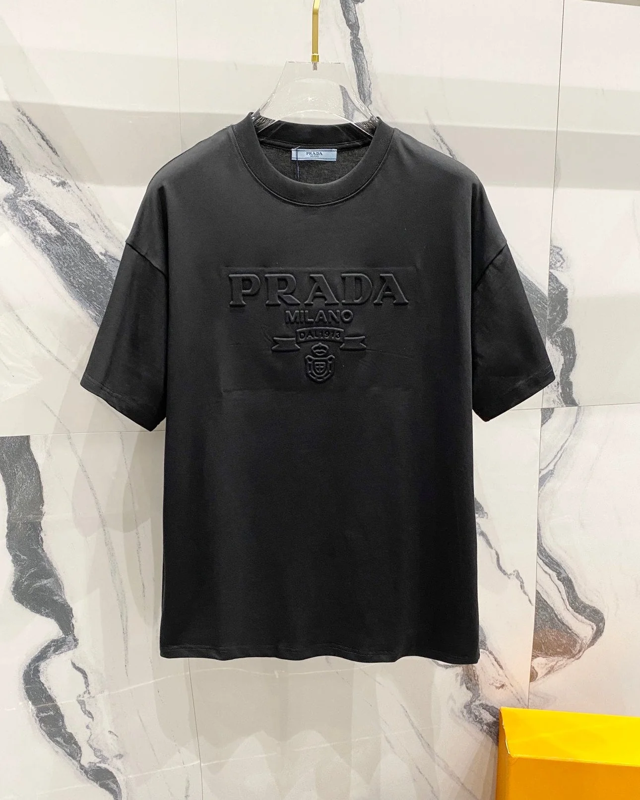 Three-dimensional embossed letter T-shirt